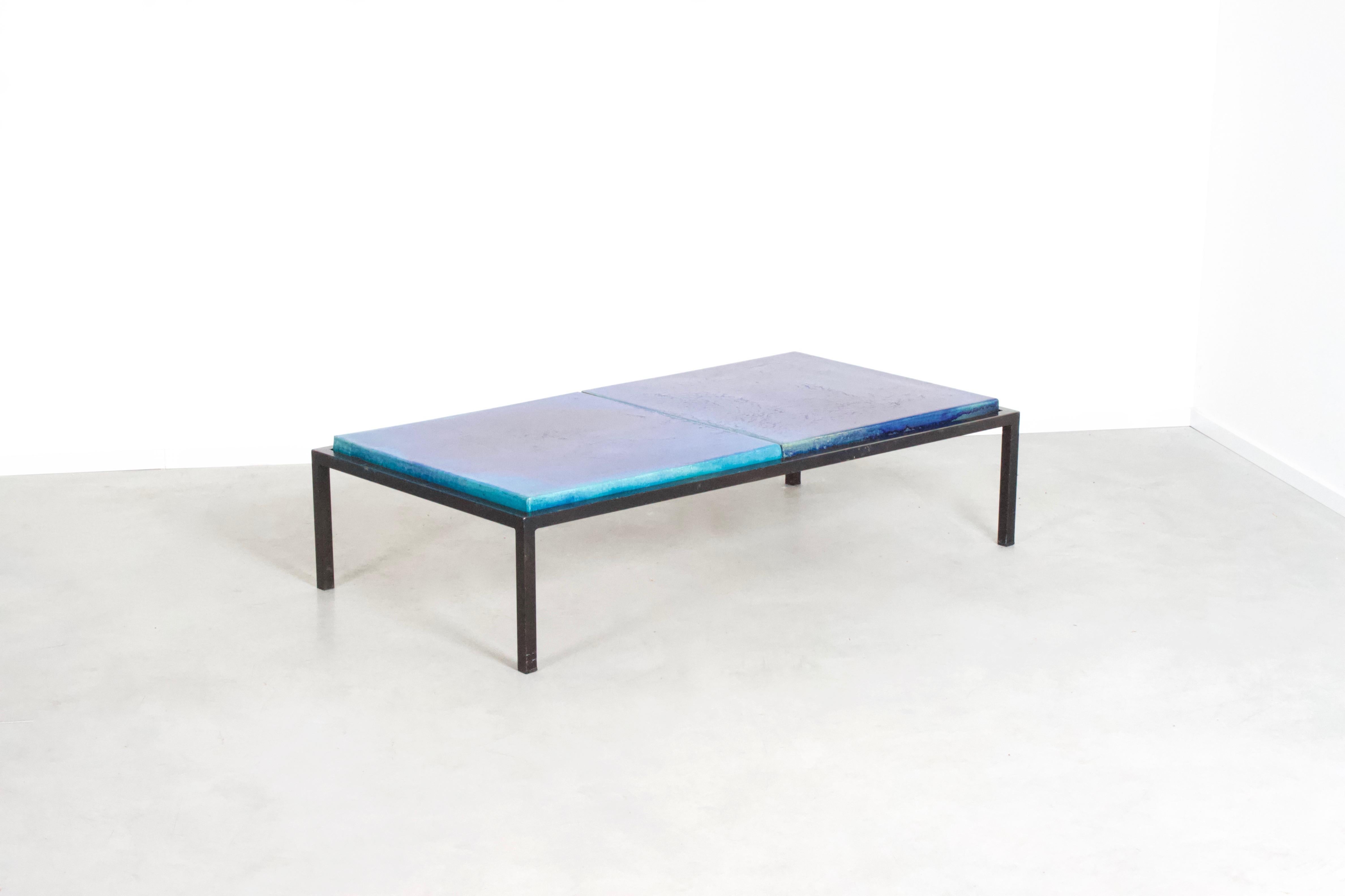 Rare tile coffee table by Majolika in very good condition.

This table consists of a black metal frame which is left in original condition. (can be professionally resprayed on request)

The frame holds two beautiful ceramic azure and blue