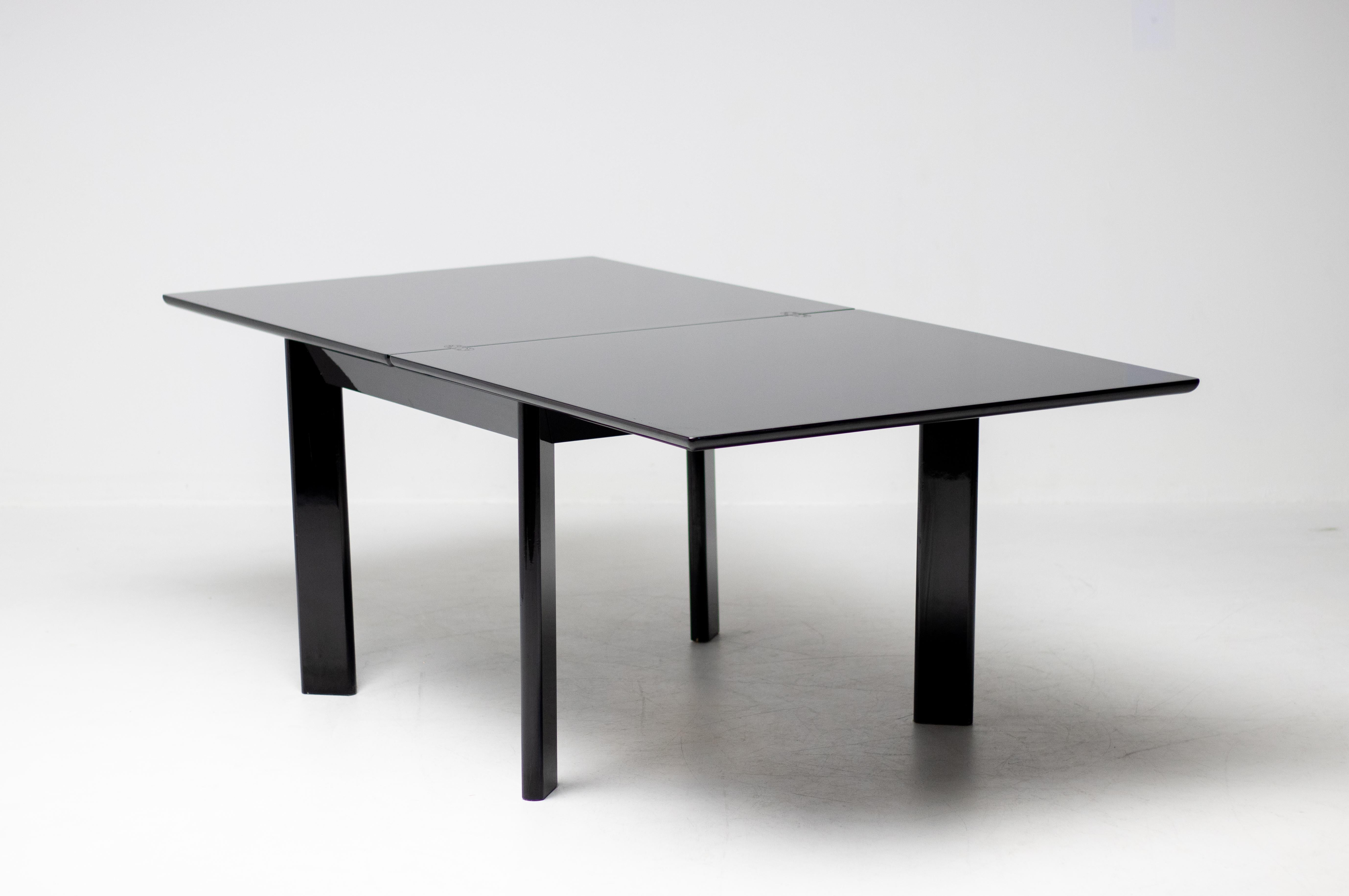 Rare early black lacquered square table by Kazuhide Takahama for Simon International that folds out to a rectangular table when desired. Magnificent lacquer quality, refined attention to detail and a very practical design by the renown Japanese
