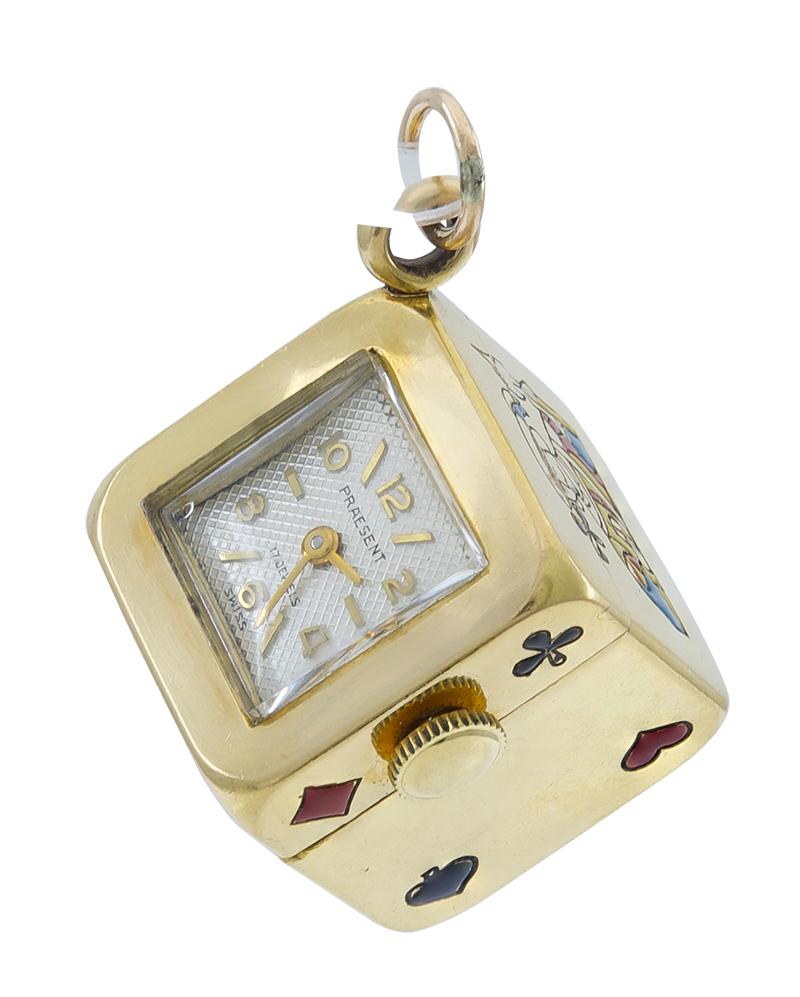 Unique charm:  a cube decorated with enamel card suits.  The top panel is a clock, with a mechanical movement, in working condition.  Heavy gauge 14K yellow gold.  2/3