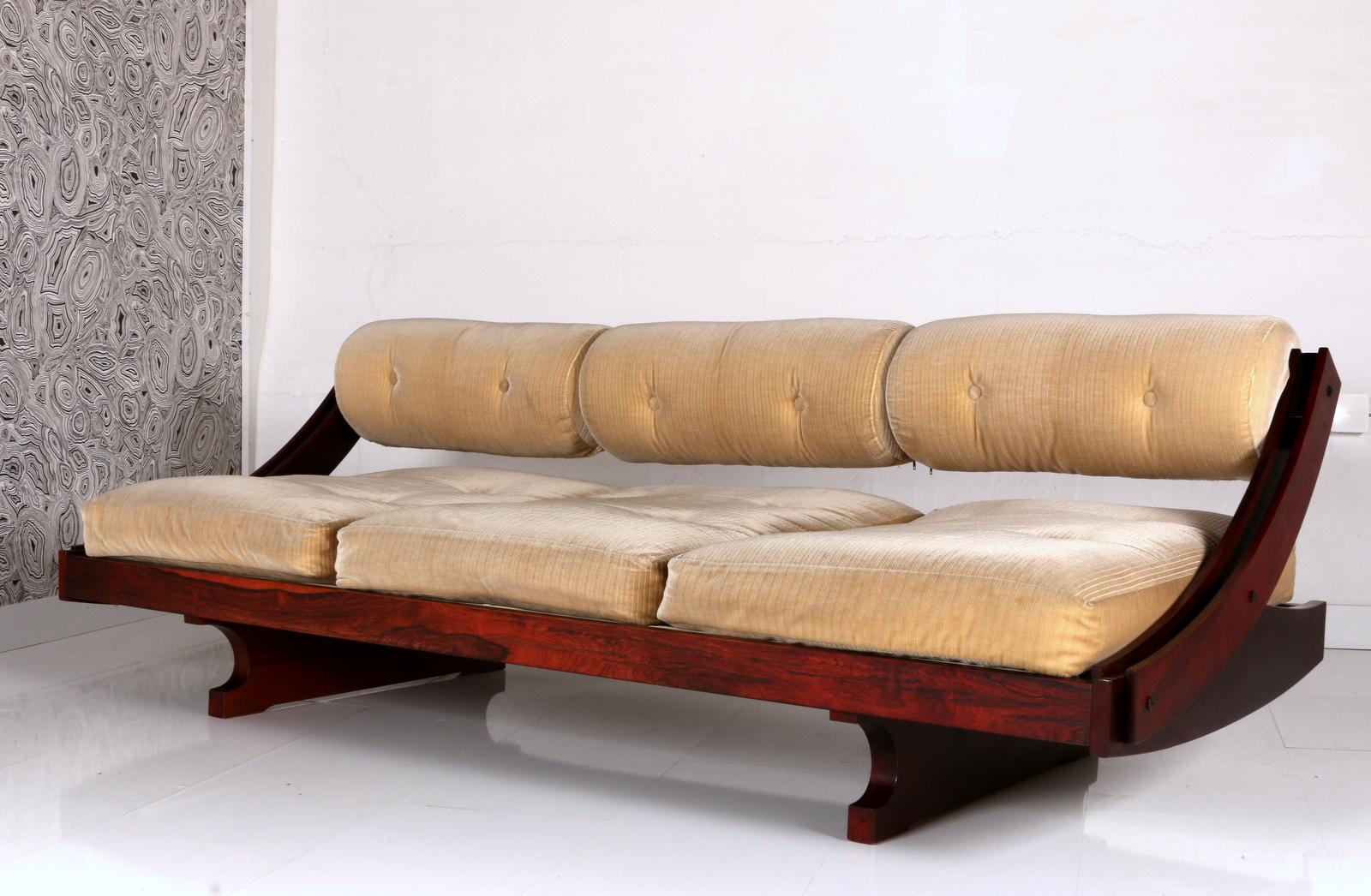 
A rare golden cord velvet daybed, crafted by the renowned designer Gianni Songia for the esteemed manufacturer Sormani, exemplifies the pinnacle of mid-century modern design. Its innovative sliding backrest seamlessly transforms the piece into a