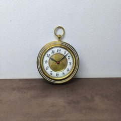 Raro orologio da parete Junghans dorato e smaltato in ottone dorato con movimento al quarzo originale