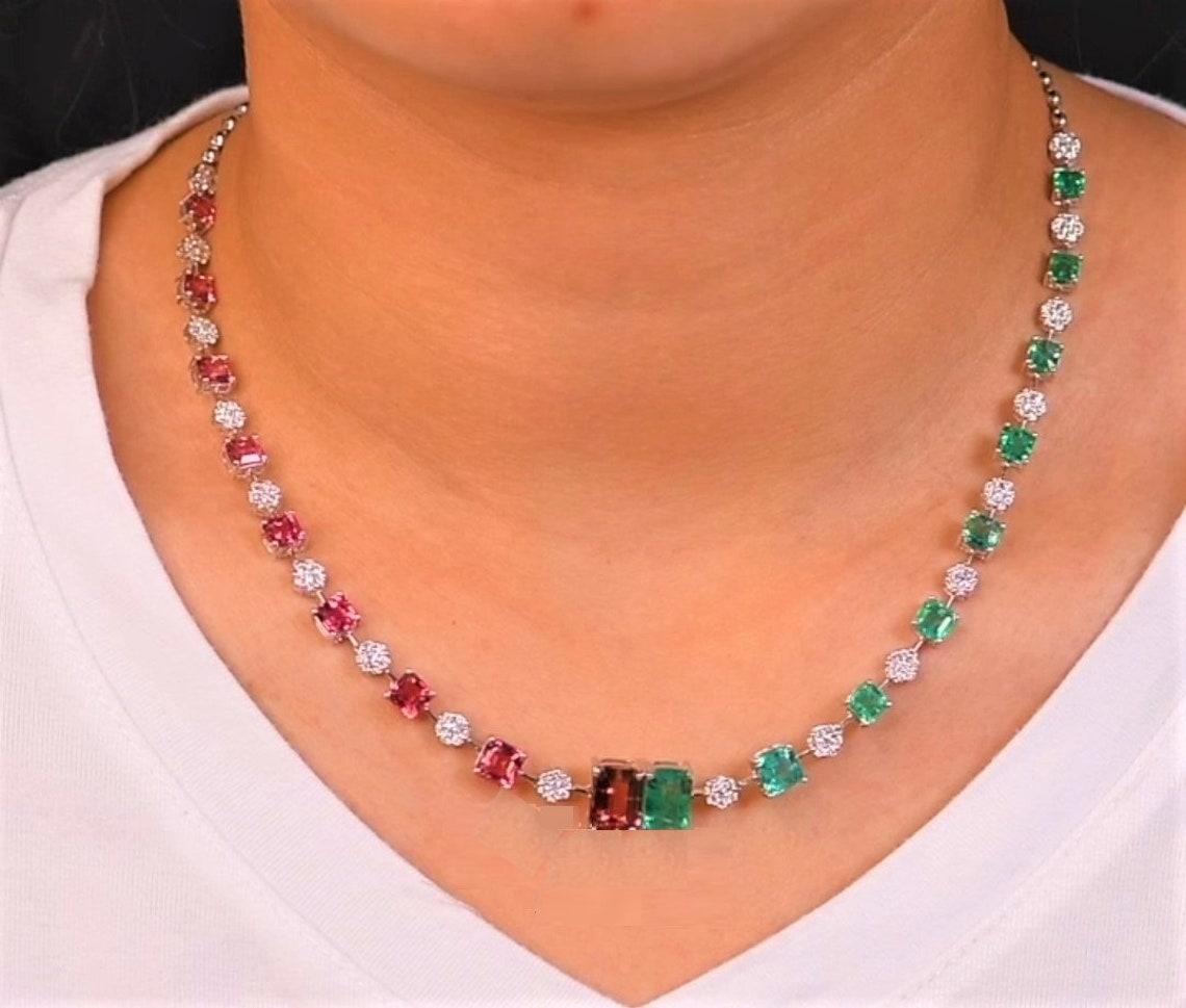 The Following Items we are offering is a Rare Important Radiant 18KT GOLD LARGE EMERALD AND DIAMOND PINK TOURMALINE NECKLACE. Necklace is comprised with a Large Finely Set Gorgeous Emeralds and Rare Pink Tourmalines Magnificent Glittering Diamonds.