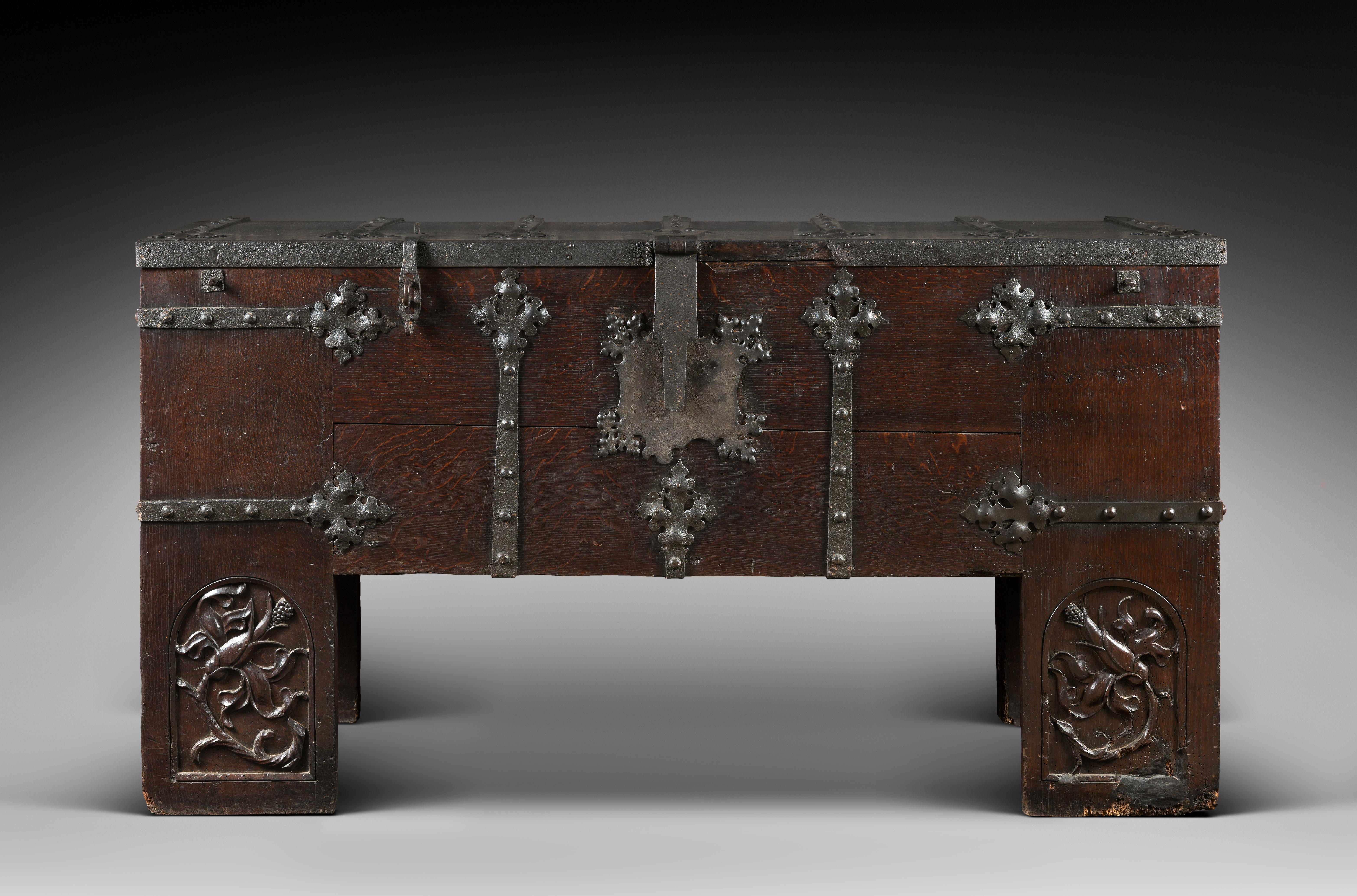 This large chest stands on high legs prolonging the lateral jambs. Presenting a sober and severe appearance the chest still belongs to the Medieval tradition. The piece is made from very high quality Hungarian wood.

The jambs are joined to the