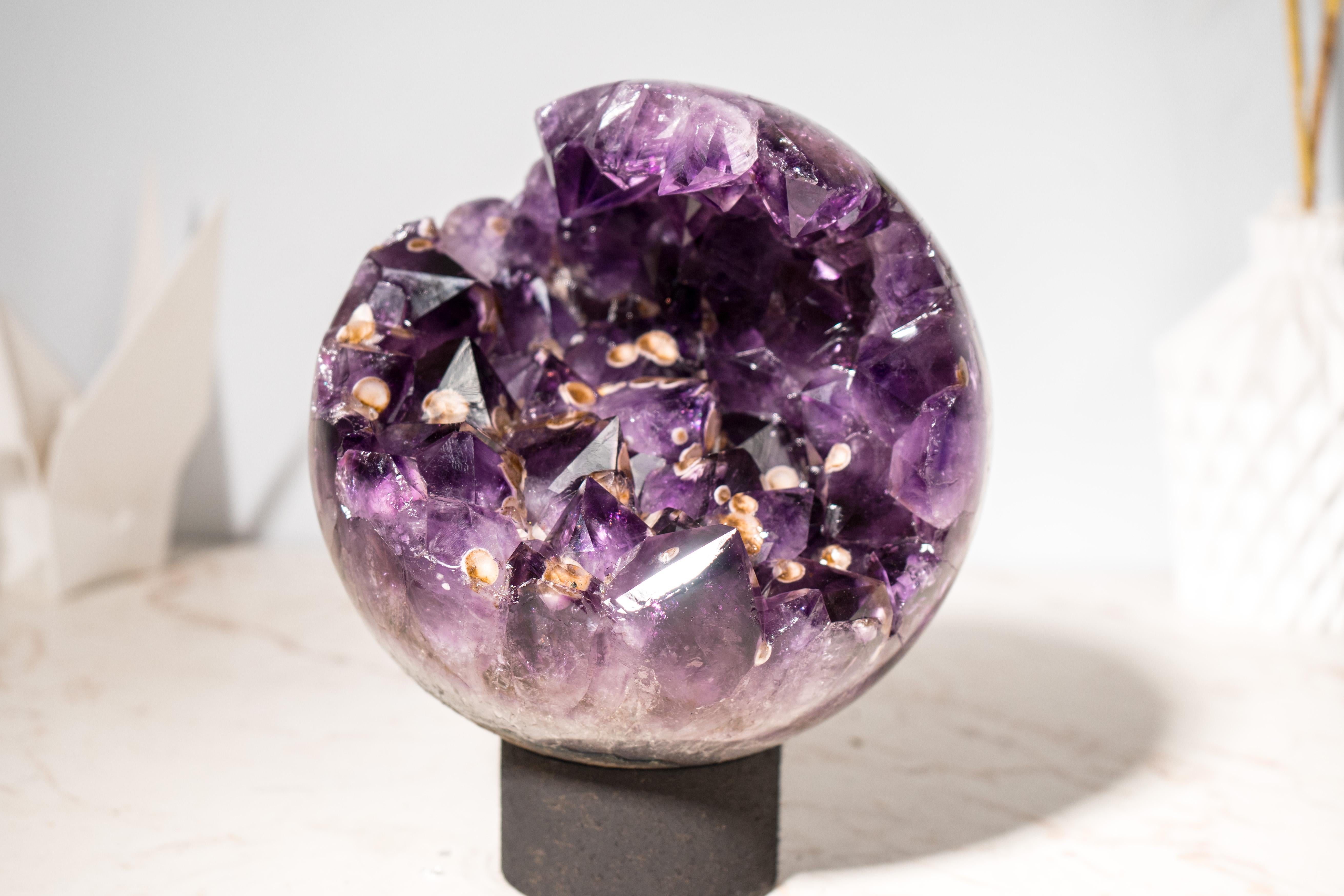 Rare Large Amethyst Sphere with Deep Purple Crystals and Cristobalite Inclusions: A Natural Statement Amethyst Sphere

▫️ Description

This rare amethyst sphere is an extraordinary specimen showcasing the finest deep-purple amethyst crystals and