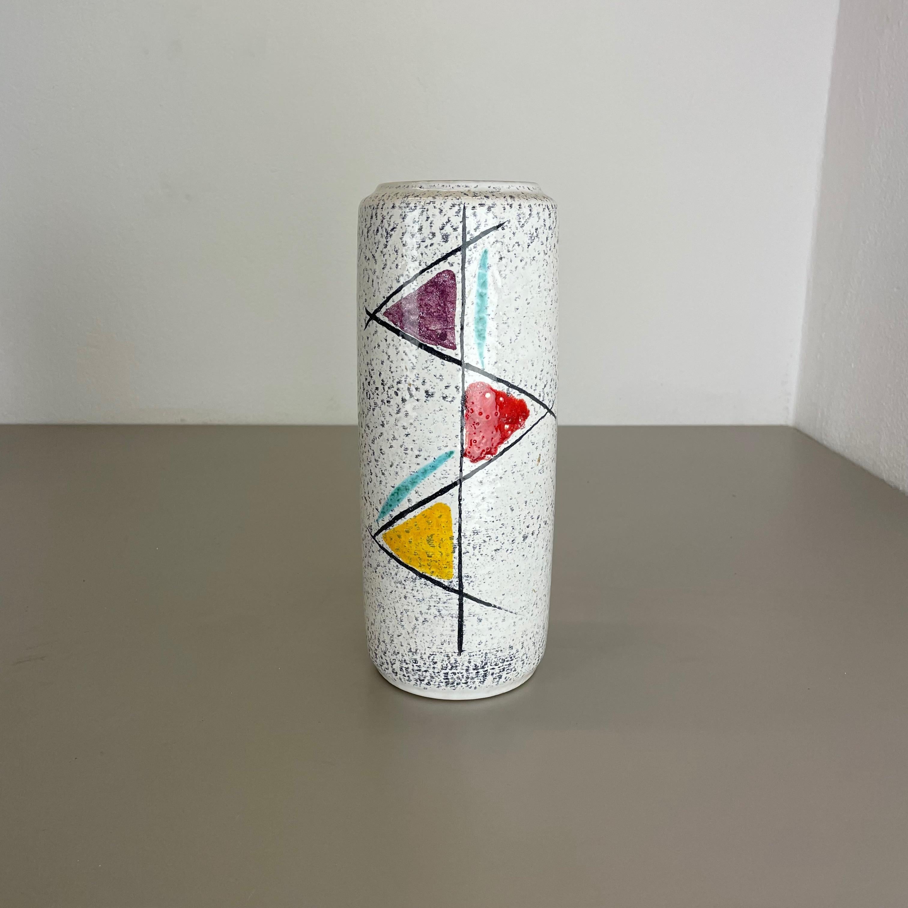 Article:

Fat lava art vase


Producer:

Scheurich, Germany



Decade:

1970s




This original vintage vase was produced in the 1970s in Germany. It is made of ceramic pottery in fat lava optic with abstract graphic illustration