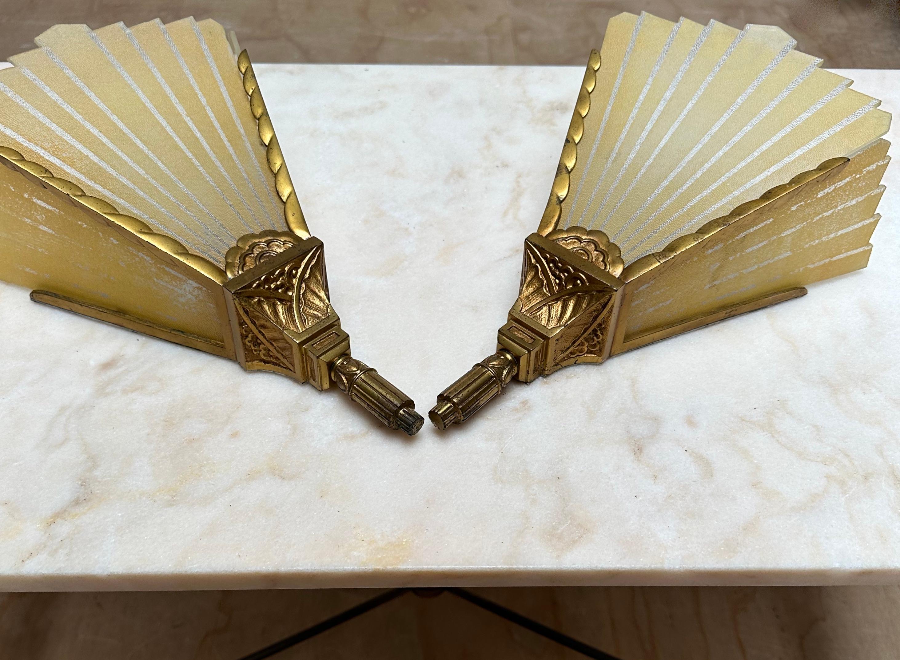 Good size, all handcrafted pair of Art Deco wall lamps.

This home of the most beautiful things on earth (1stdibs) also is home to the rarest, most practical and most decorative items on earth and these wall sconces too fit that bill. This