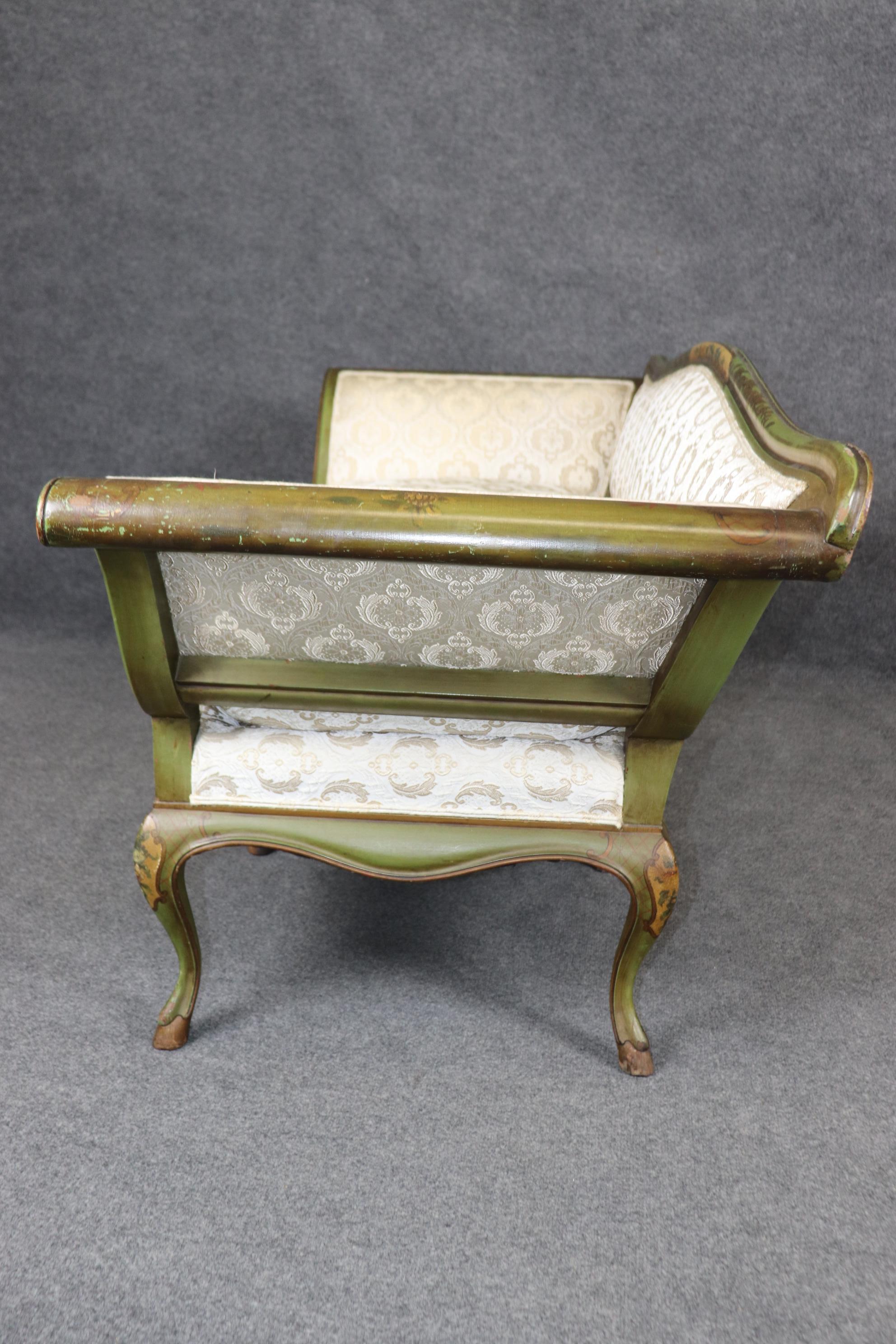 This is a wonderfully rare and unique gondola form Italian-made Chinoiserie painted settee. The settee is just wonderful in terms of its proportions and painted scenery. The piece shows minor abrasions and chips to the painted finish as shown and
