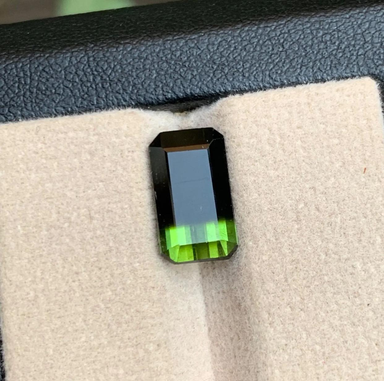 Gemstone Type: Tourmaline
Weight: 4.30 Carats
Dimensions: 12.39 x 7.13 x 5.42
Color: Bicolor
Clarity: Slightly Included 
Treatment: Not Treated
Origin: Afghanistan
Certificate: On demand 

Indulge in the enchantment of our rare Bicolor emerald cut