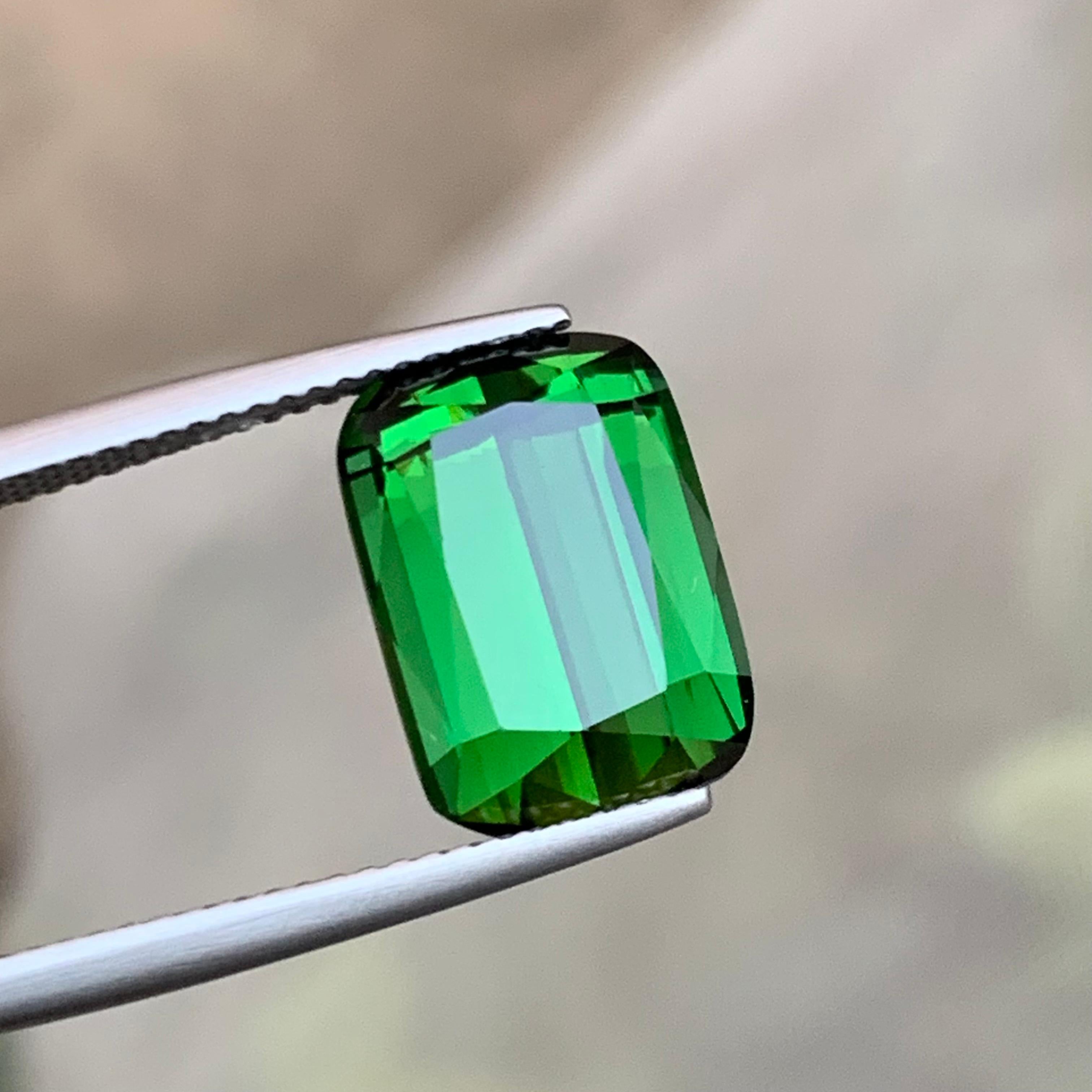 Exquisite 7.75 Carat green natural Tourmaline gemstone, sourced from the rare Kunar mines of Afghanistan. Its lustrous green hue captivates, and the step cushion cut enhances its beauty. Perfect for an elegant ring setting, this gem is a timeless