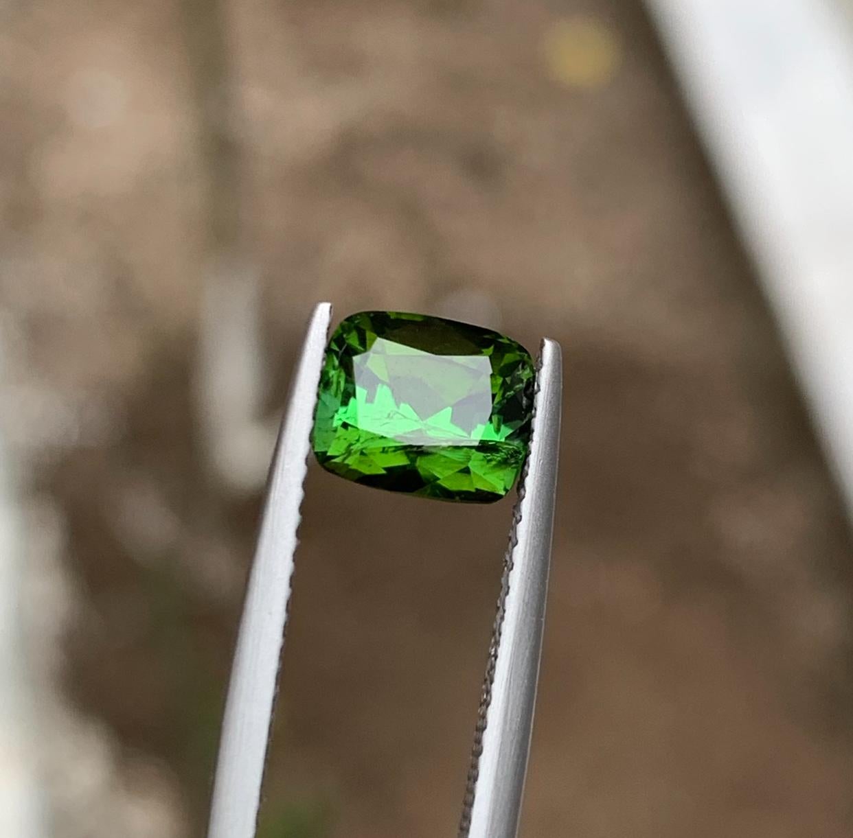 GEMSTONE TYPE: Tourmaline
PIECE(S): 1
WEIGHT: 2.10 Carats
SHAPE: Cushion
SIZE (MM): 6.52 x 7.68 x 5.77
COLOR: Green
CLARITY: Slightly Included 
TREATMENT: None
ORIGIN: Afghanistan
CERTIFICATE: On demand

Quite beautiful 2.10 Carats natural green