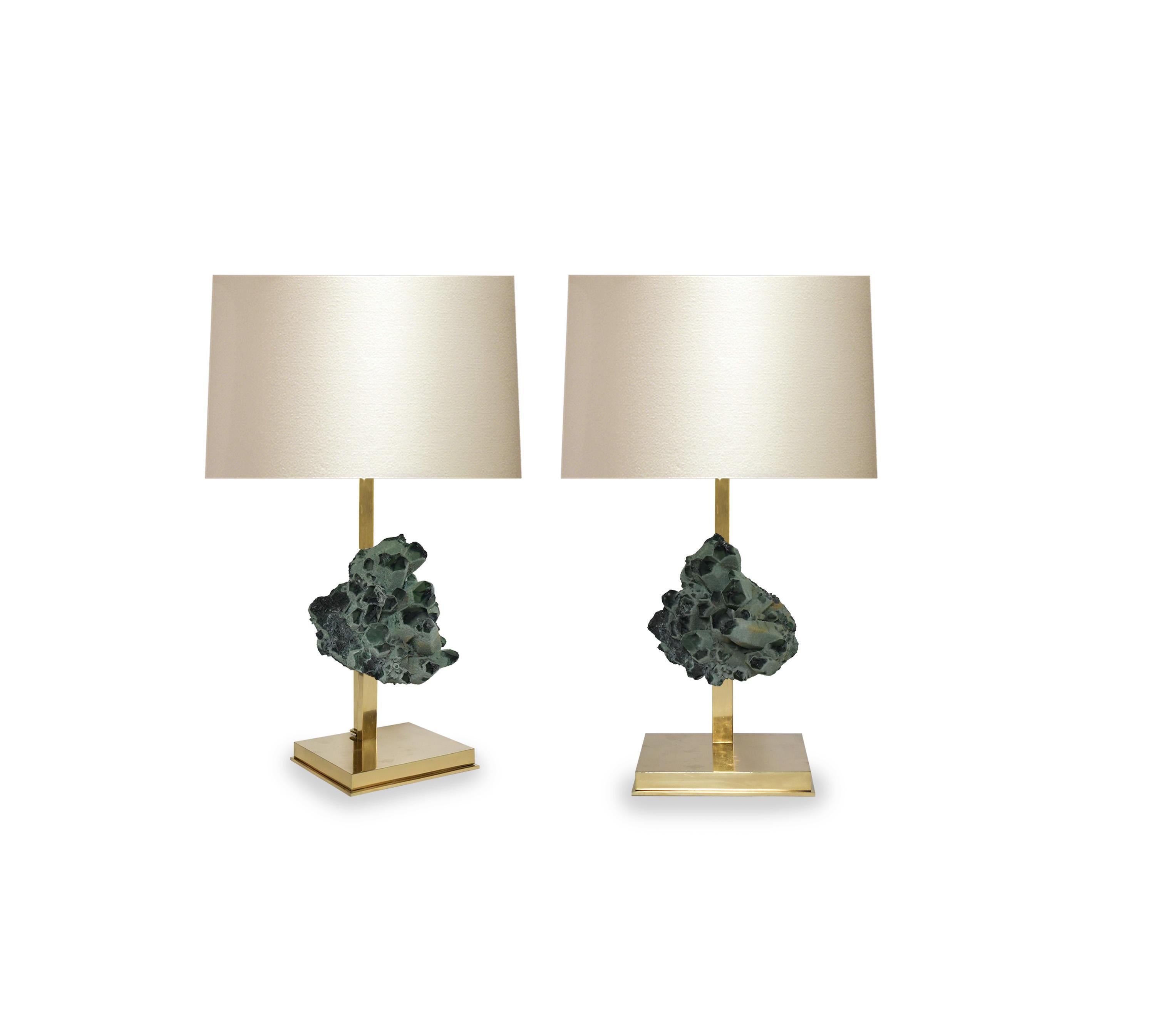 Pair of rare natural green rock crystal cluster mount as lamps with polished brass bases. Create by Phoenix Gallery, NYC.
Each lamp installs two sockets.
Lampshade do not include.