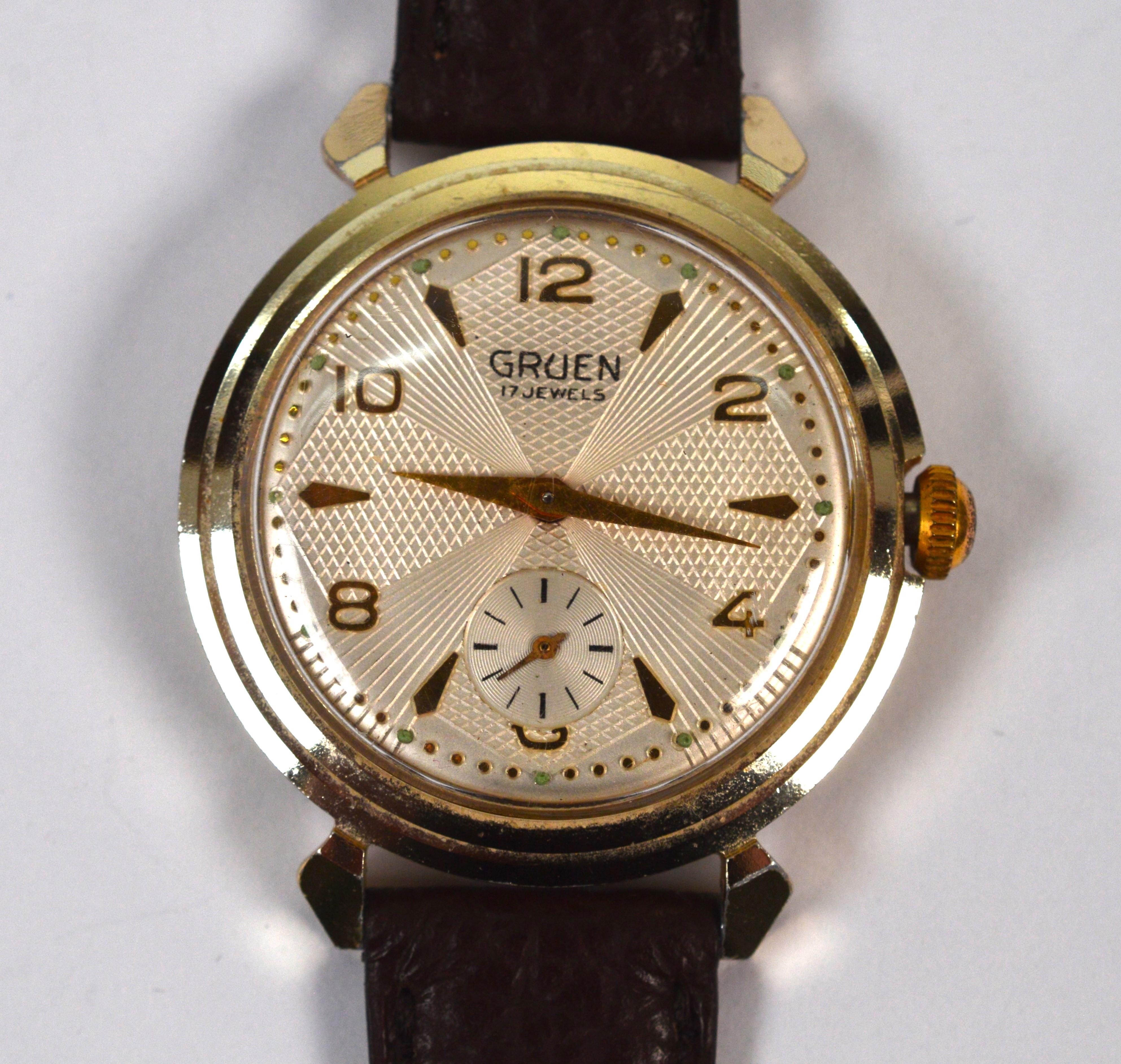 We love vintage timepieces and this one of our favorite finds by Gruen Watch. Circa 1940's and in amazing condition, this sharp looking Gruen 416 Swiss Wrist Watch is rarely seen. In size 34mm with a silver/copper front case and steel back case by