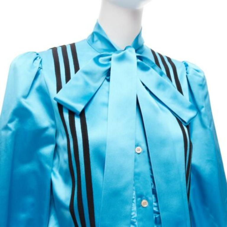 rare GUCCI ADIDAS blue silk 3 stripe pussy bow Victorian puff sleeve blouse IT38
Reference: AAWC/A00676
Brand: Gucci
Designer: Alessandro Michele
Collection: Adidas - Runway
Material: 100% Silk
Color: Blue, Black
Pattern: Solid
Closure: Button
Extra