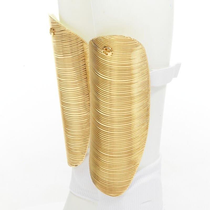 rare GUCCI Alessandro Michele 2019 Runway GG logo gold padded shin guards socks
Reference: TGAS/C01512
Brand: Gucci
Designer: Alessandro Michele
Model: 5958154 HH74 1080
Collection: Runway
Material: Metal
Color: Gold, White
Pattern: Solid
Closure: