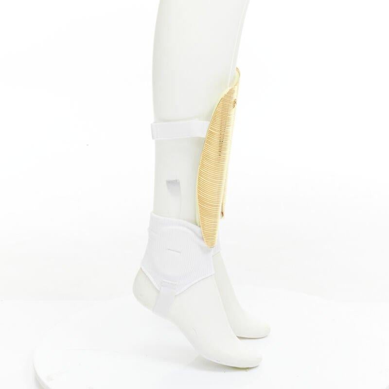 Women's Rare GUCCI Alessandro Michele 2019 Runway GG logo gold padded shin guards socks For Sale