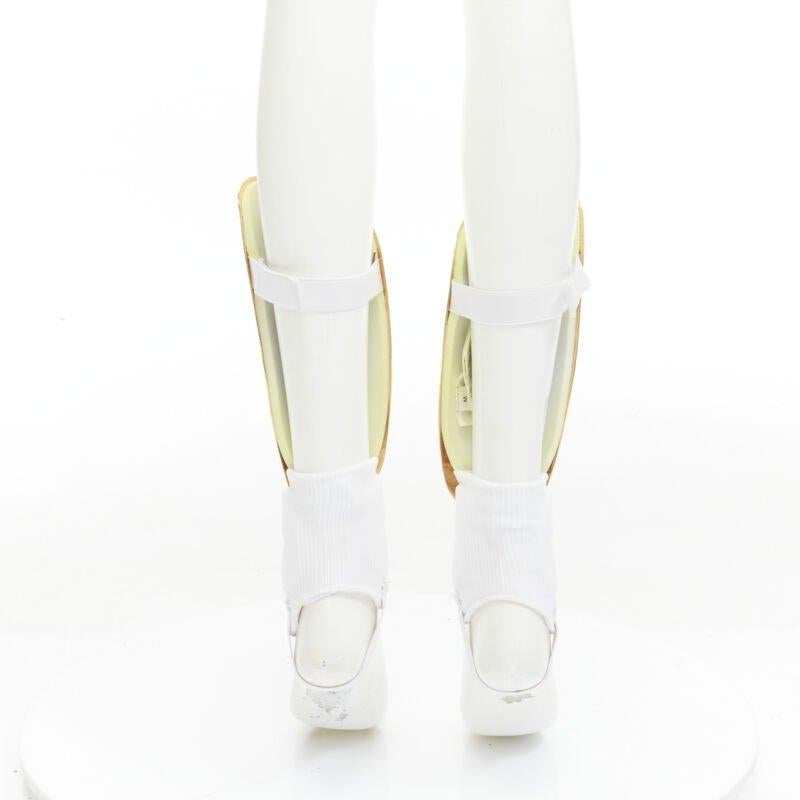 Women's rare GUCCI Alessandro Michele 2019 Runway GG logo gold padded shin guards socks For Sale