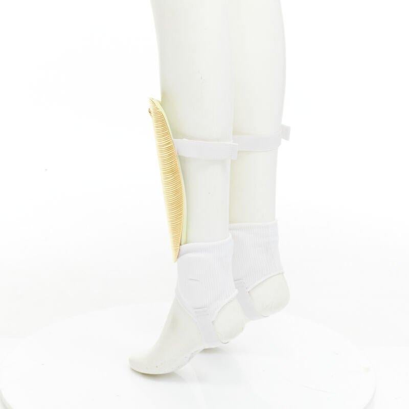 Rare GUCCI Alessandro Michele 2019 Runway GG logo gold padded shin guards socks For Sale 2