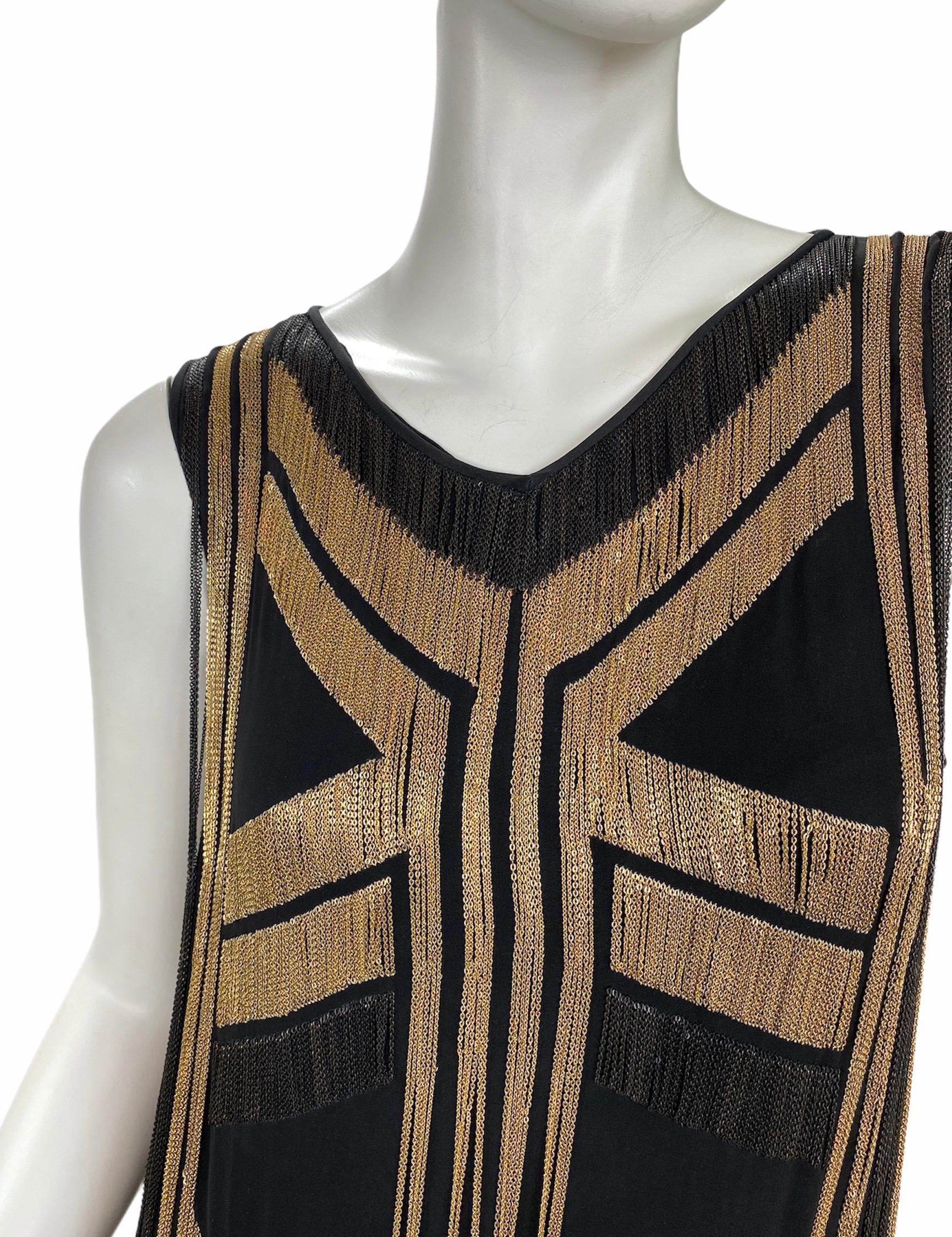 Rare Gucci Fringed chain-embellished silk-georgette dress 

Gucci glamorously re-imagines the Roaring Twenties with this flapper-inspired silk-georgette dress. Covered in delicate yet tough-talking gold and black chains, this captivating runway