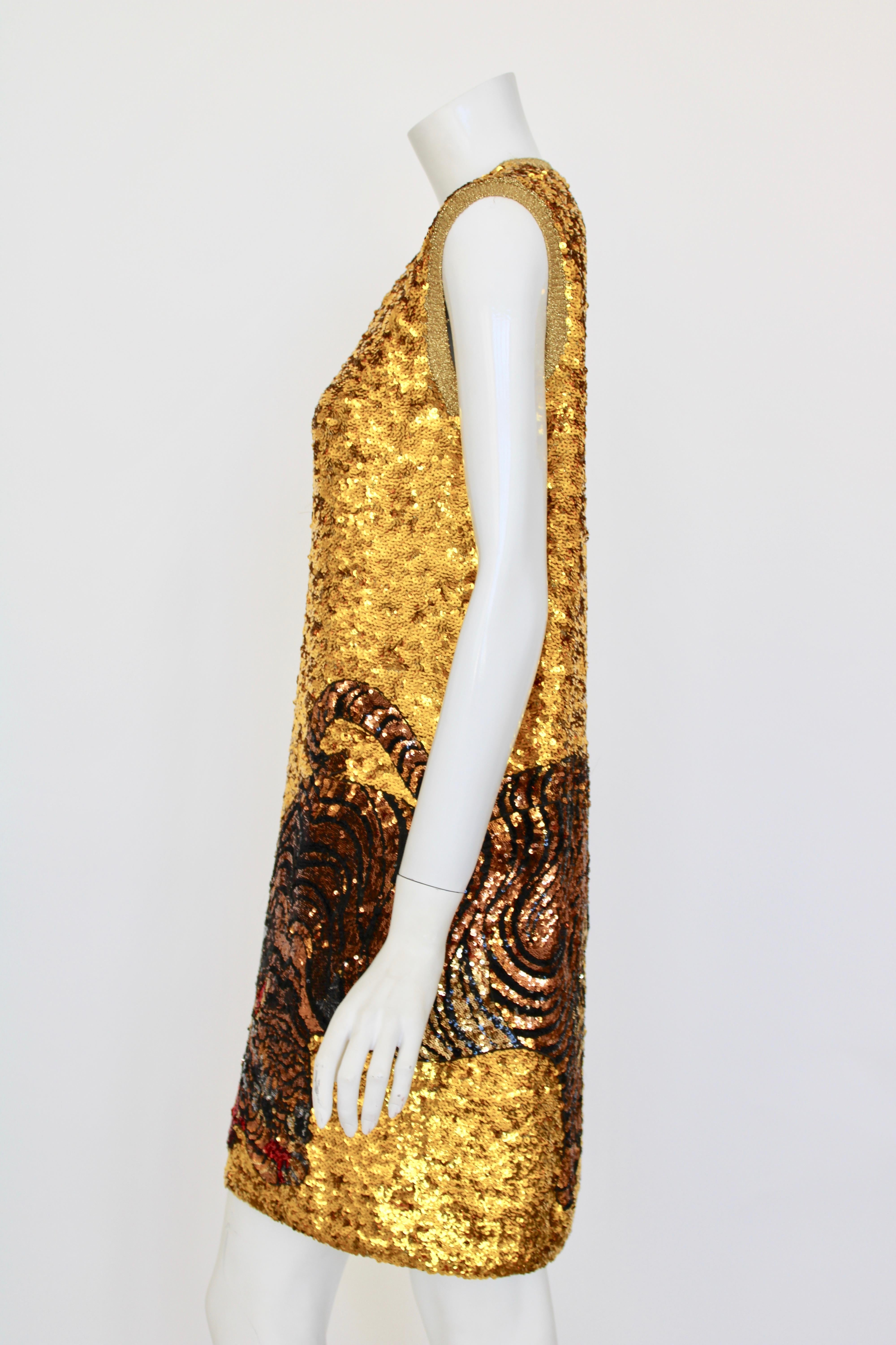 Sleevless shift dress, fully sequined. Lurex ribbed collar & armholes. Sequin tiger design wrapped from back to front. 