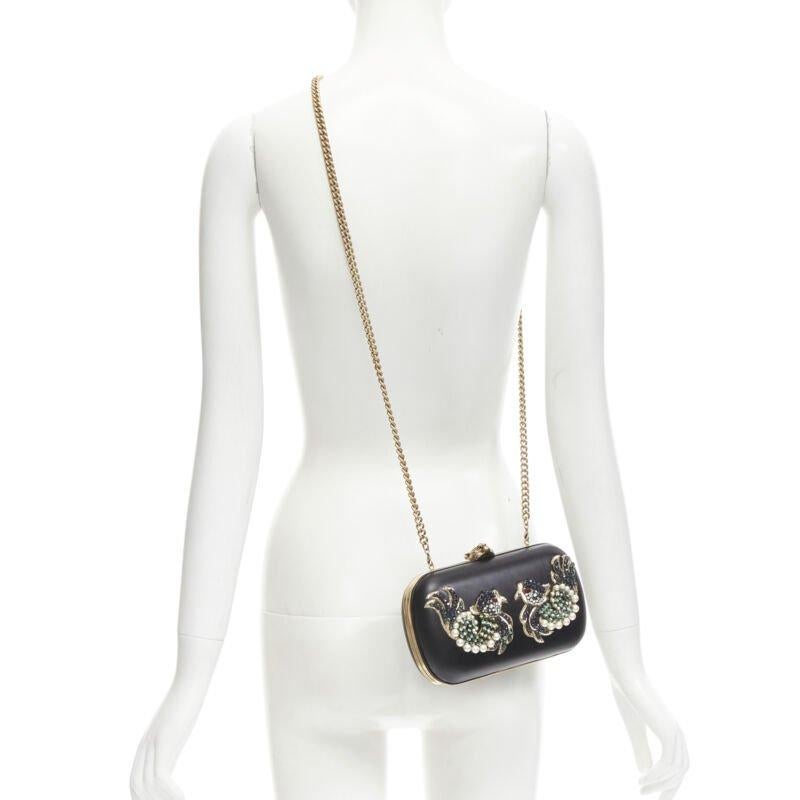 rare GUCCI Limited Edition black Double Swallow crystal pearl embellished clutch
Reference: KNLM/A00240
Brand: Gucci
Designer: Alessandro Michele
Model: 436084 000926
Collection: Limited Edition
Material: Leather, Metal
Color: Black, Gold
Closure: