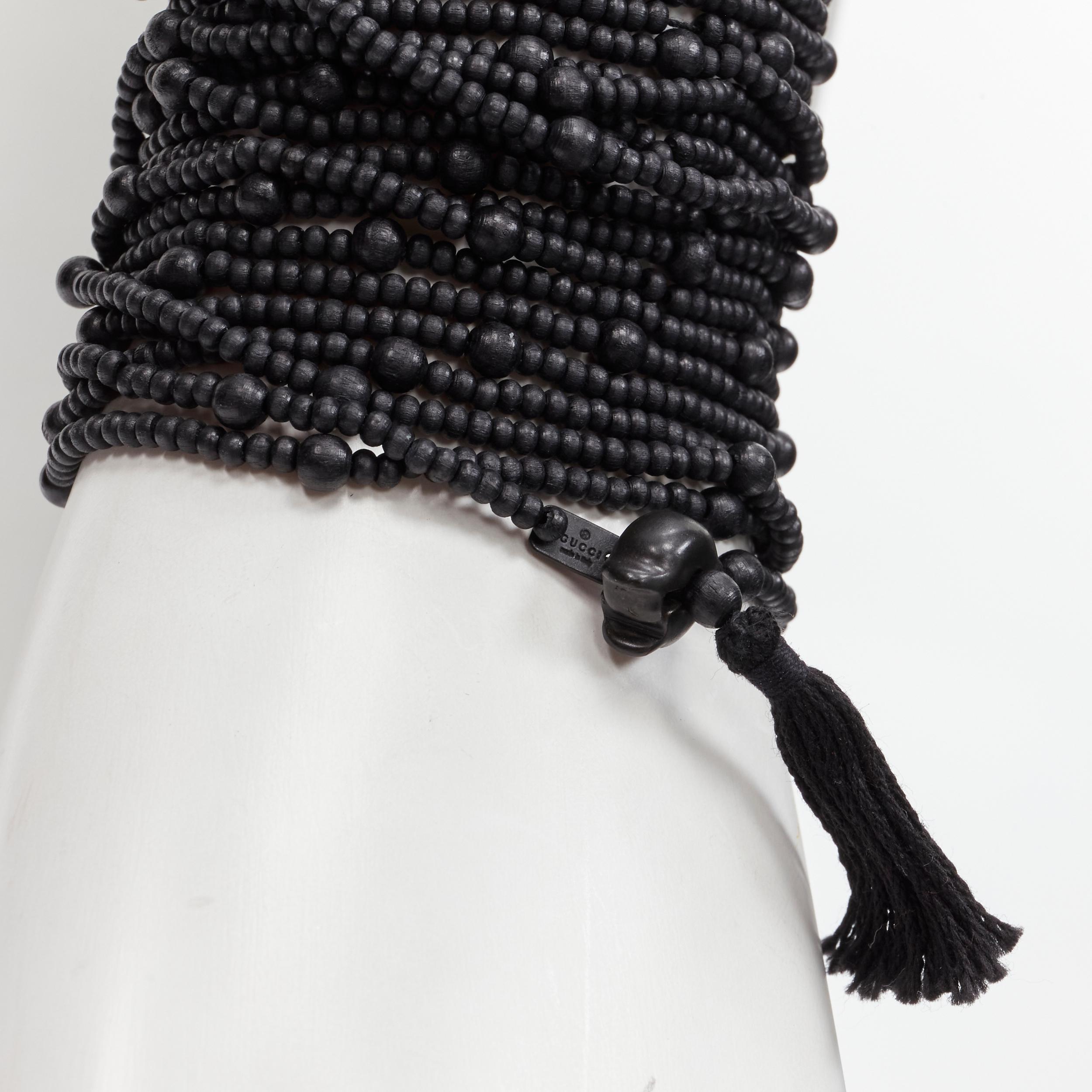 rare GUCCI Tom Ford 2002 Runway Ebony Cross black beaded fringed wrap bracelet
Reference: ANWU/A00893
Brand: Gucci
Designer: Tom Ford
Collection: 2002 - Runway
Material: Plastic
Color: Black
Pattern: Solid

CONDITION:
Condition: Excellent, this item