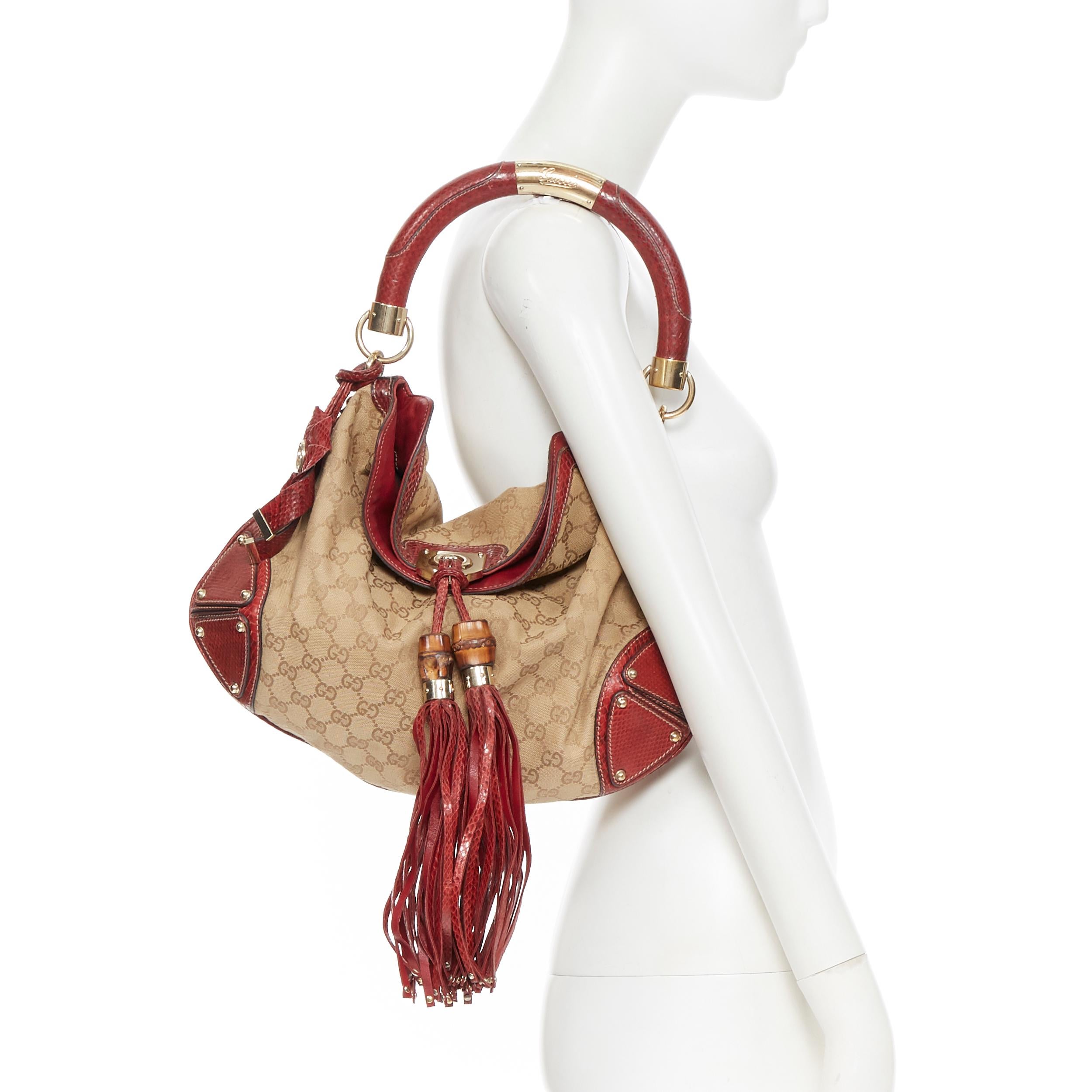 rare GUCCI Unicef Indy brown GG monogram red leather bamboo flap shoulder bag 
Reference: MAWG/A00042 
Brand: Gucci 
Model: Indy 
Collection: 2007 UNICEF 
Material: Fabric 
Color: Red 
Pattern: Other 
Closure: Zip 
Extra Detail: Brown GG canvas