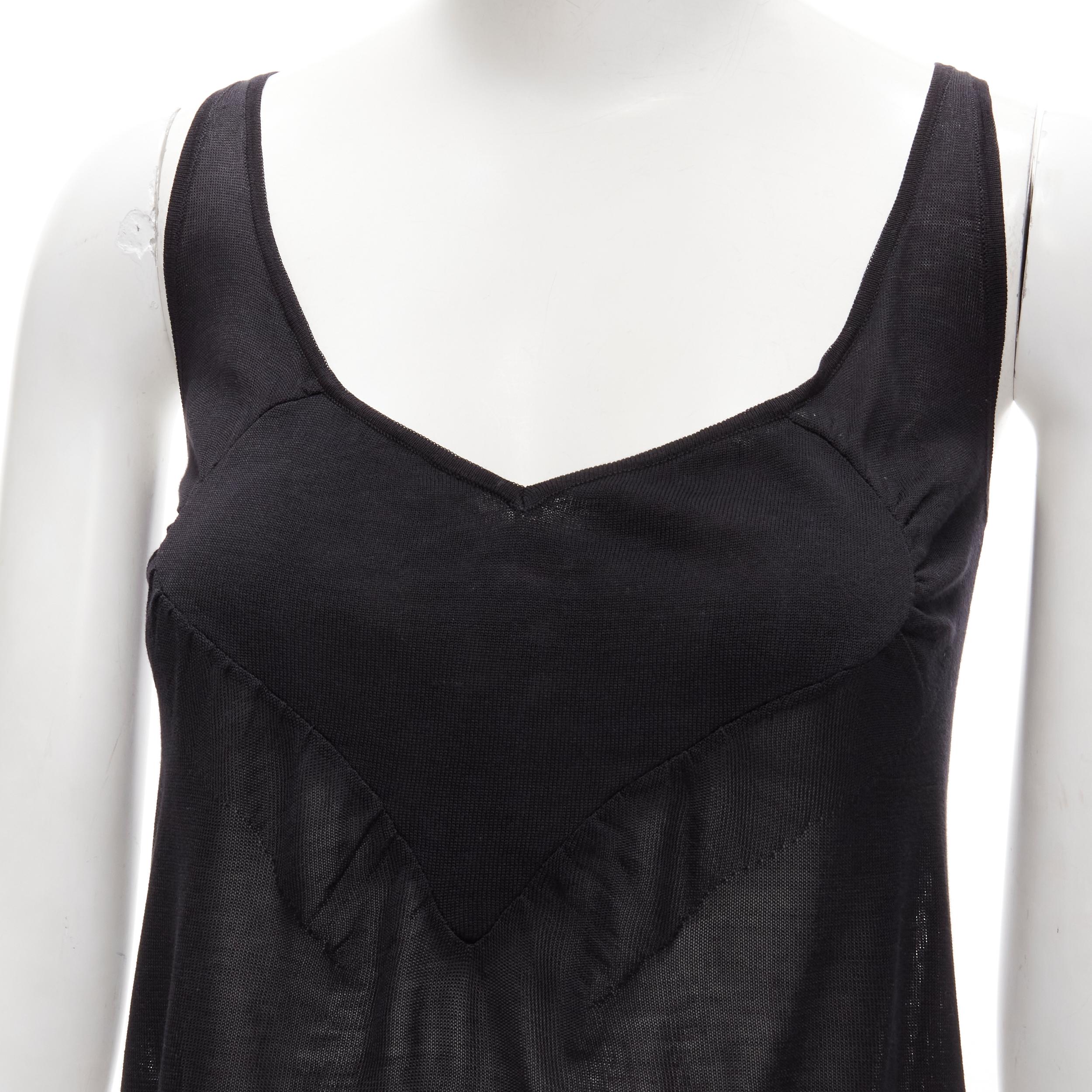 rare GUCCI Vintage Y2K heart seam black ribbed crop tank top XS 
Reference: ANWU/A00610 
Brand: Gucci 
Material: Black 
Color: Black 
Pattern: Solid 
Extra Detail: Heart shaped seam detailing at chest. Scooped neckline. 
Made in: Italy 


CONDITION: