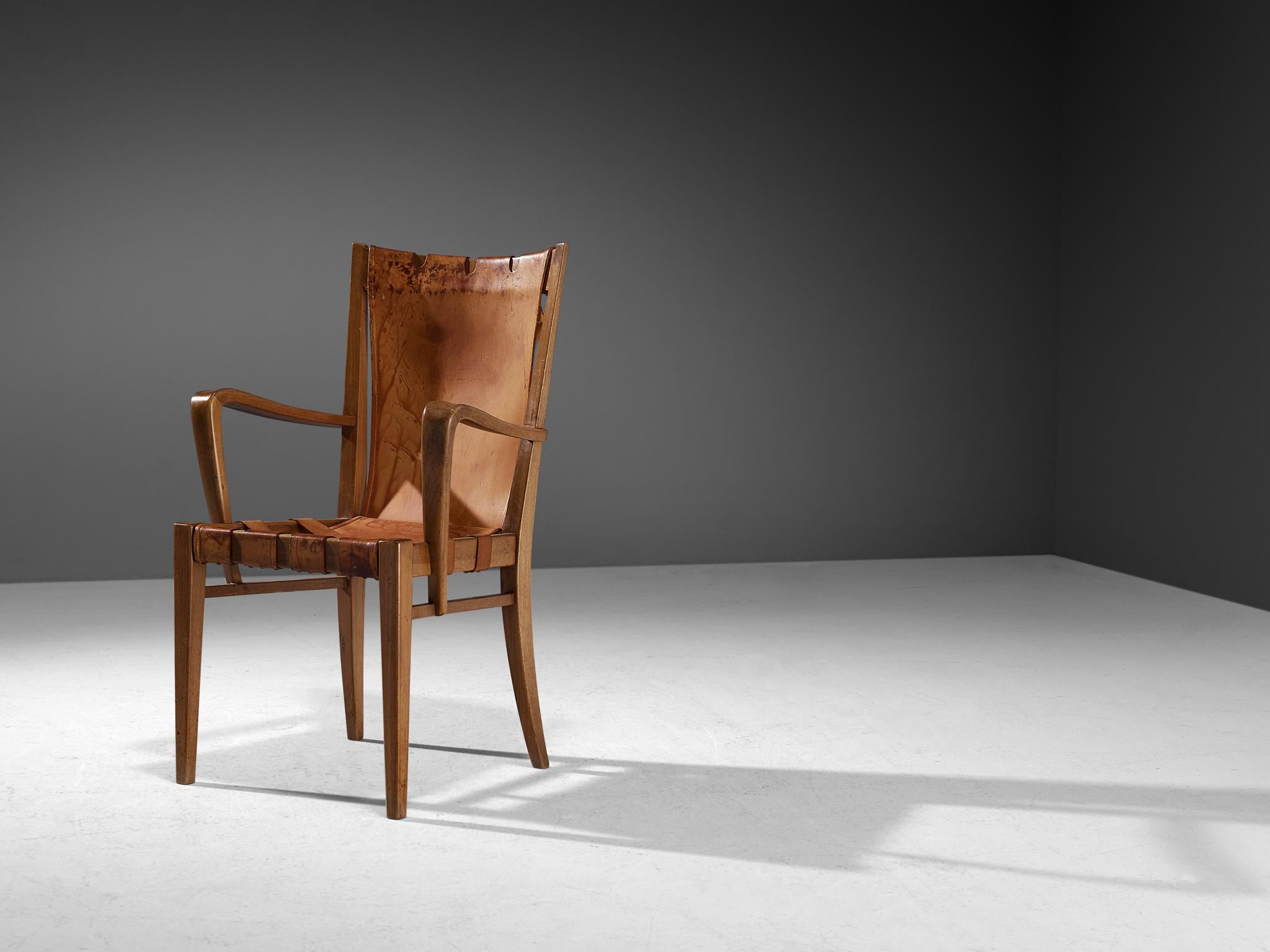 Guglielmo Pecorini, armchair, walnut, leather, brass, Italy, circa. 1940 

This wonderfully sculpted lounge chair is designed by Italian designer Guglielmo Pecorini The sincere construction and type of upholstery, give the chair a character of its