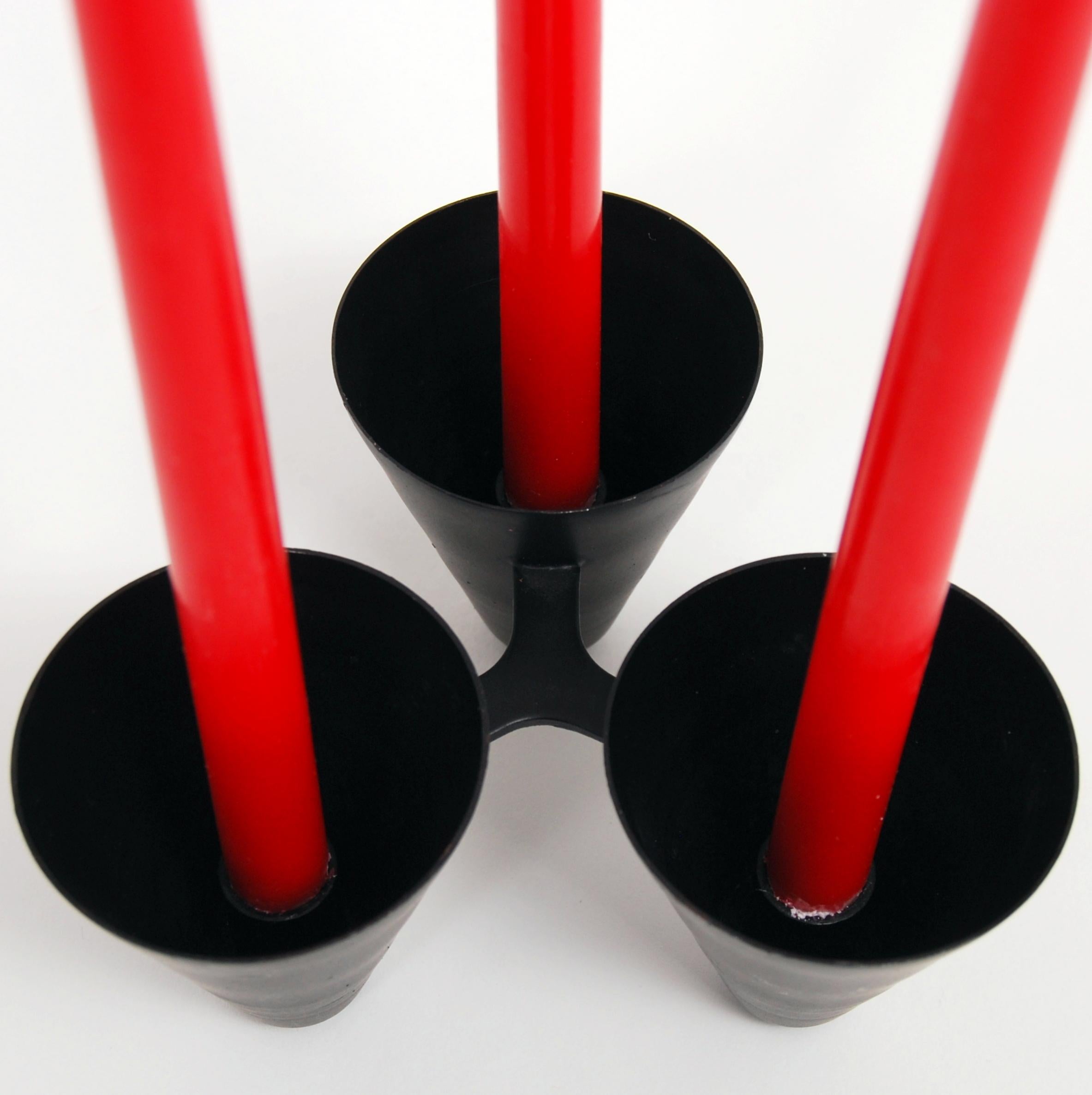 A Gunnar Ander candleholder in black metal for three candles. Manufactured by Ystad Metall.
 