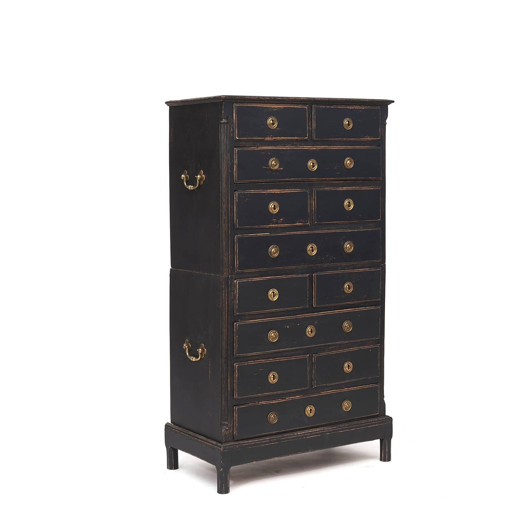 Rare Gustavian / Louis XVI chest of drawers.
'Chest on chest' with 12 drawers, 4 large and 8 smaller. Made of black painted oak.
Original bronze fittings on the front and carrying handles on the sides.
Sides with fluted quartz columns.
The chest