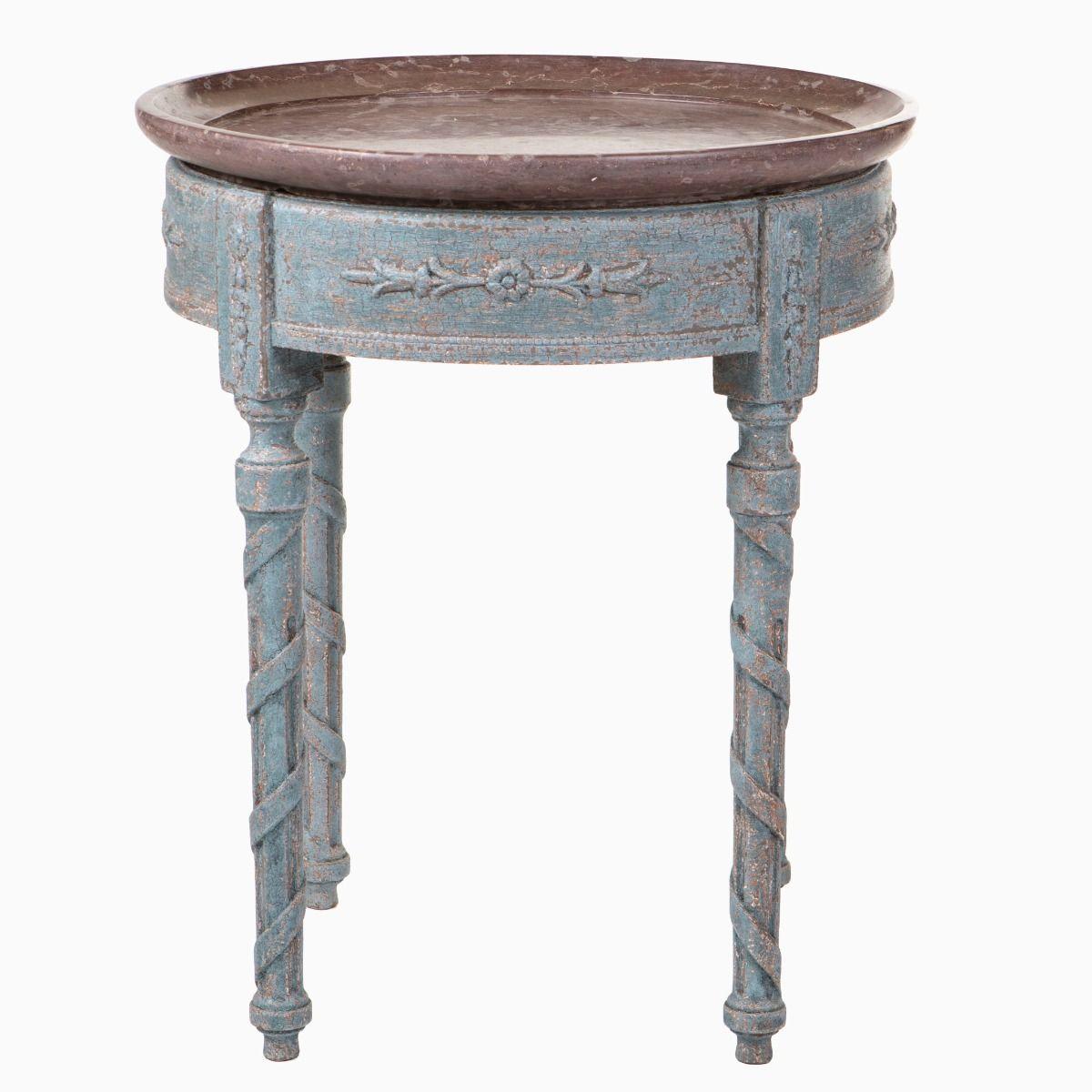 Gustavian tray table with Öland limestone top
A rare and decorative table with a blue-painted base and an apron adorned with floral and foliate carvings.
The legs are fluted and embellished with carved twisted bands.
The tabletop is designed as a