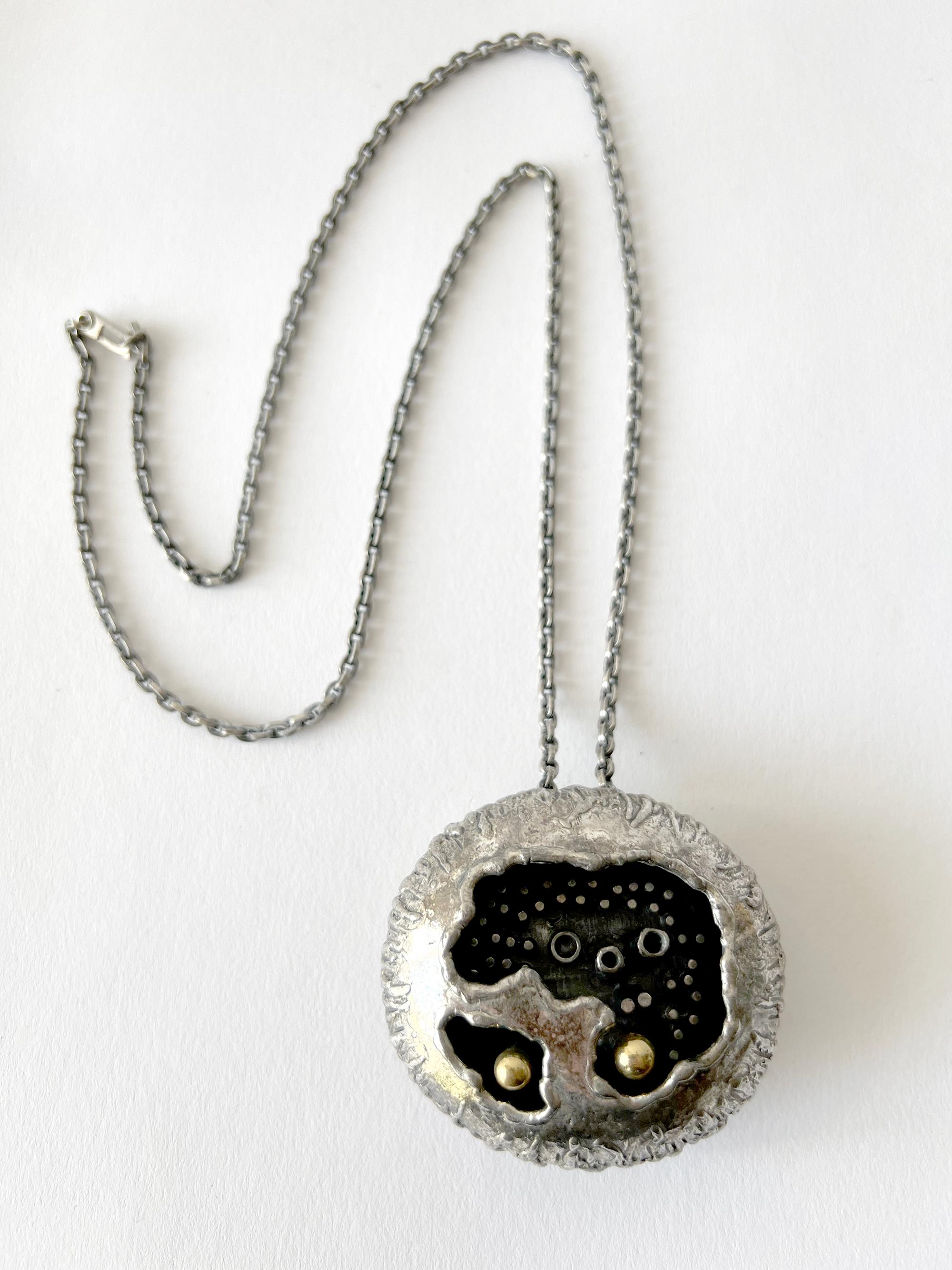 Brutalist pewter alloy necklace created by sculptor and jeweler Guy Vidal of Canada.  Pod measures 2.5