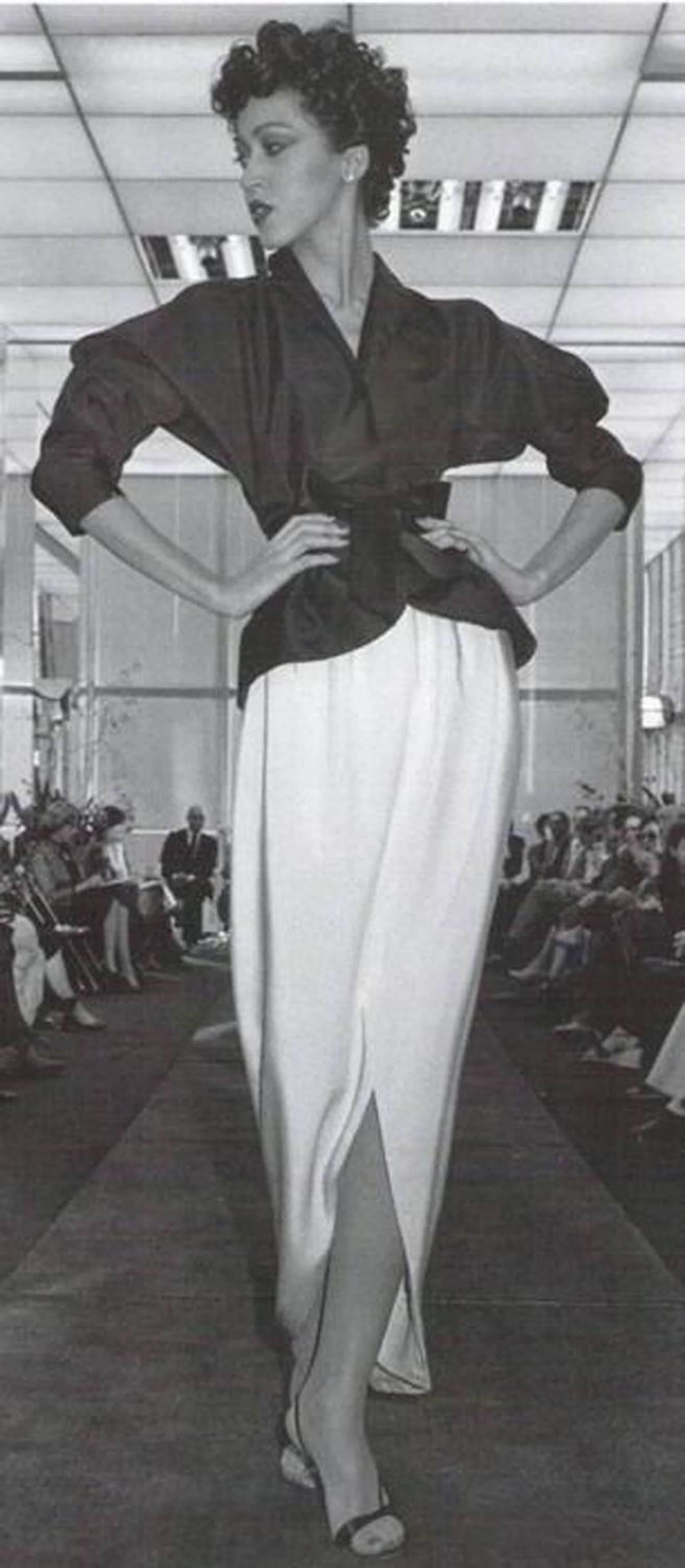 This amazing tulip skirt was made by Halston in the mid 1970 and was documented in the runway photo shown as image 9 (as modeled by Pat Cleveland, one of the original Halstonettes).  Made from a gorgeous creme silk crepe, it features a cream colored