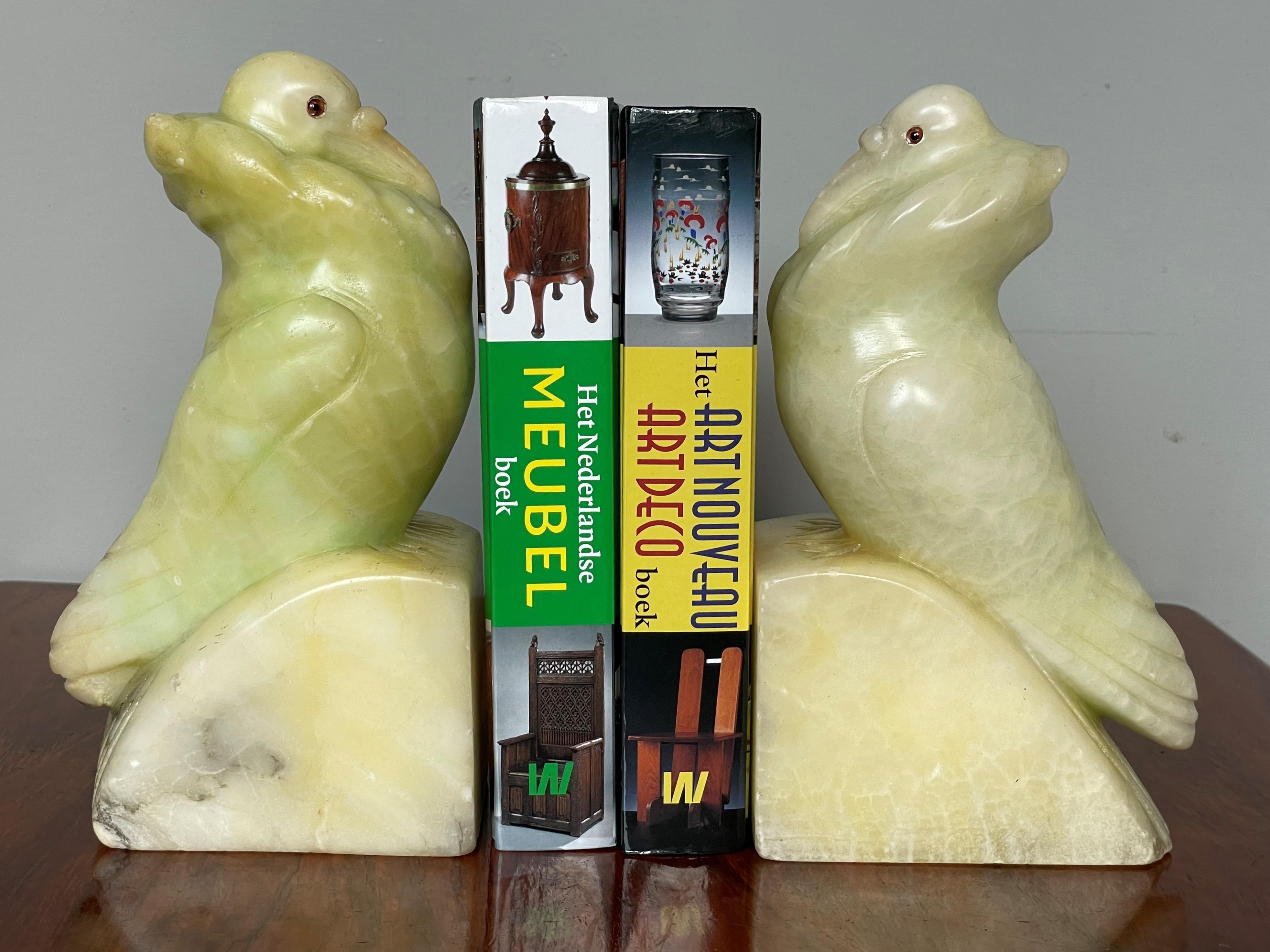 Unique pair of antique bookends in a rare color alabaster.

If you are looking for decorative, practical, very well handcrafted and meaningful bookends then this pair could be perfect for you. Birds in general often are vibrant and beautiful