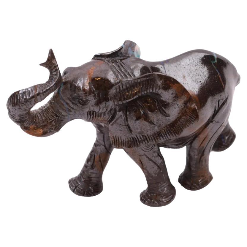 A rare hand carved dark opal stone figure. The figure depicts an elephant with a raised trunk, engraved with detailed patterns. Unmarked. Circa: 20th century. Vintage and Modern Asian Oriental Indian Natural Stone Figurines, Figures, Statues, Home