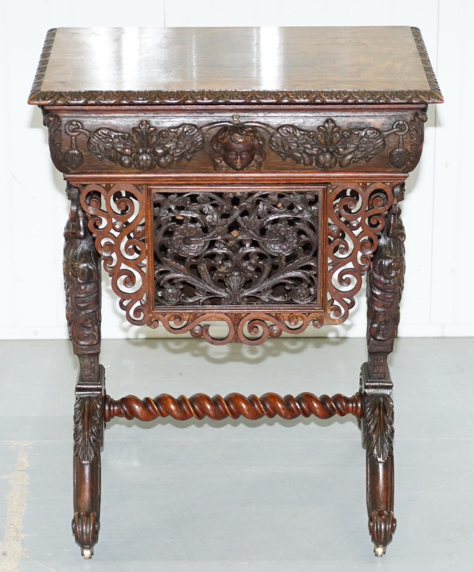 We are delighted to offer for sale this lovely original Victorian hand carved from top to bottom sewing table with angels / putti figured heads in the 17th century manor

A truly glorious piece, it must have taken the craftsman months to complete,