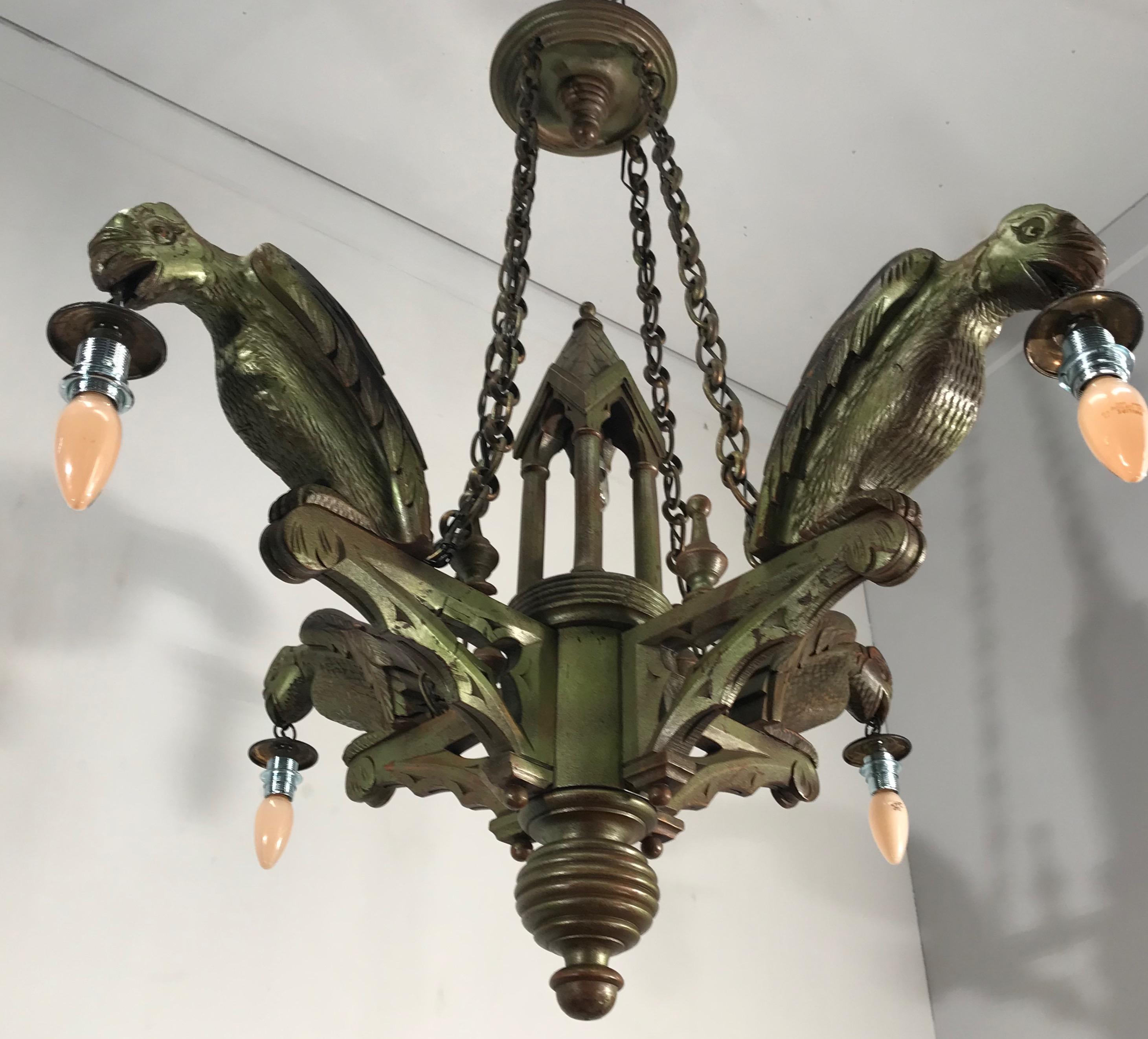 Antique and good size Gothic Revival light fixture. 

If you are looking for an out of the ordinary chandelier then this antique European light fixture in the Gothic style could be perfect for you. All hand carved out of solid wood and metalized