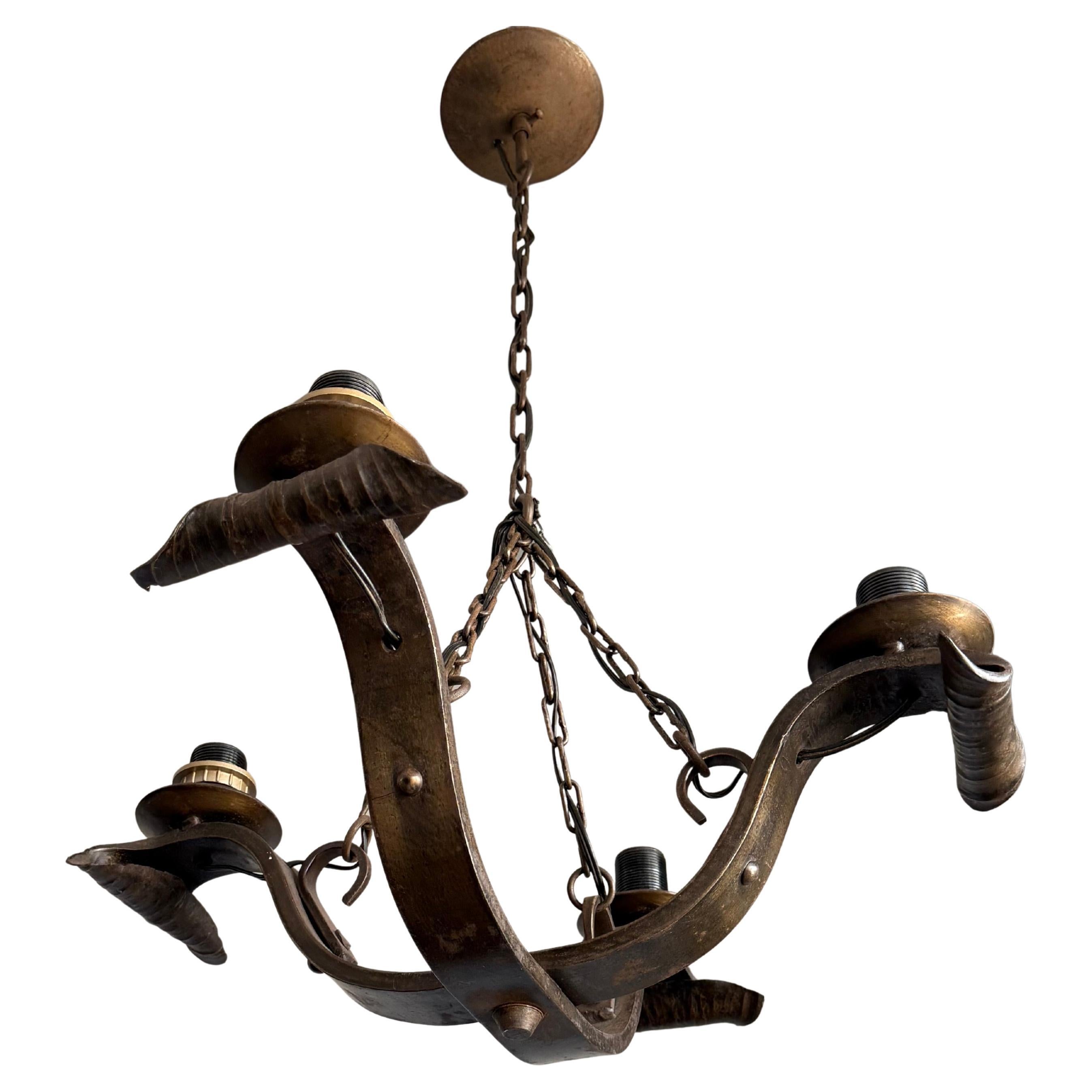 Rare Hand-Forged Wrought Iron 4-Light Chandelier with Sculptural Curl Detailing For Sale