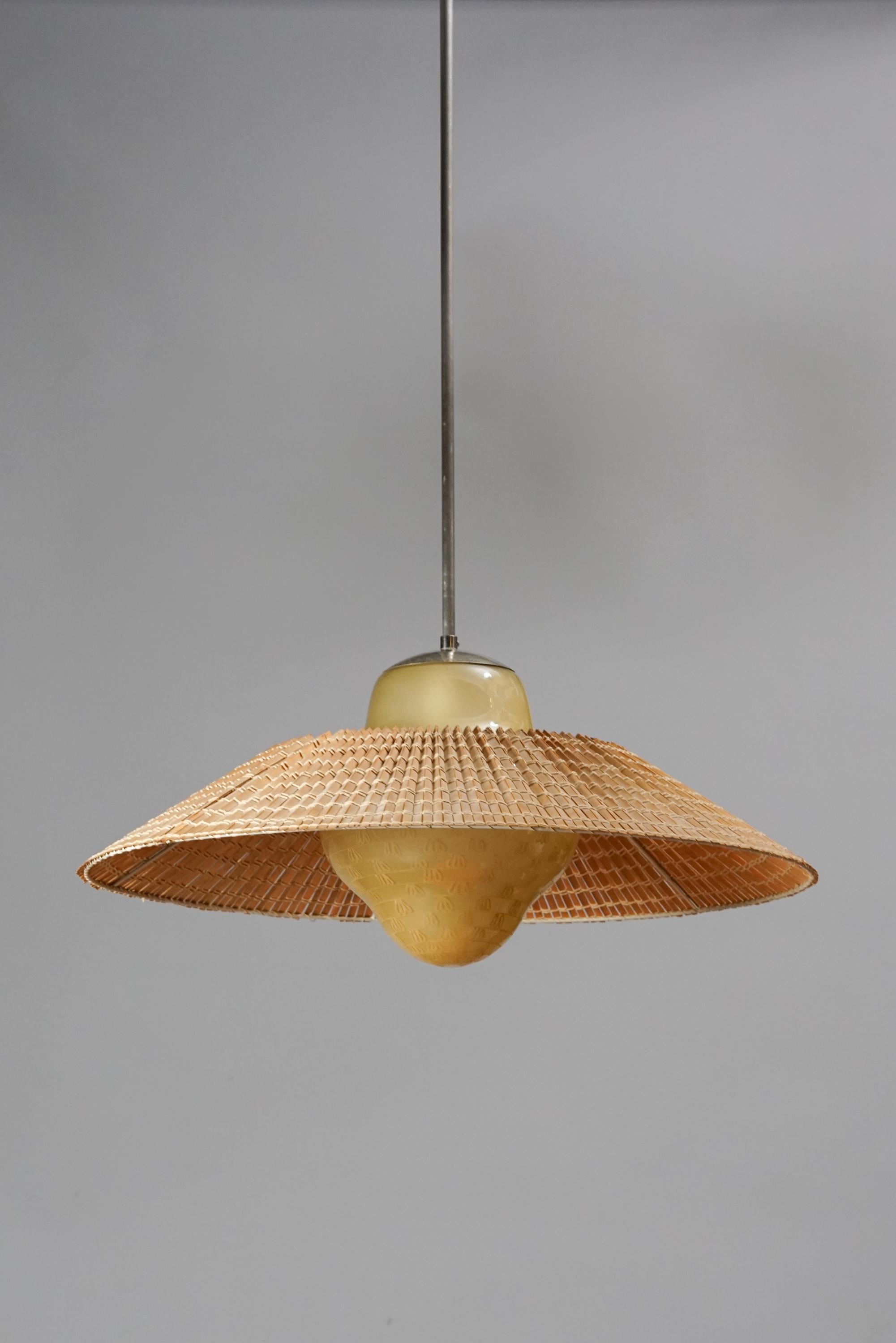 Rare hand painted ceiling lamp model 1032 by Gunilla Jung, for Orno Finland in the 1940s. Hand painted opaline glass with rattan shade, good vintage condition. Rare model. Manufacturers stamp.