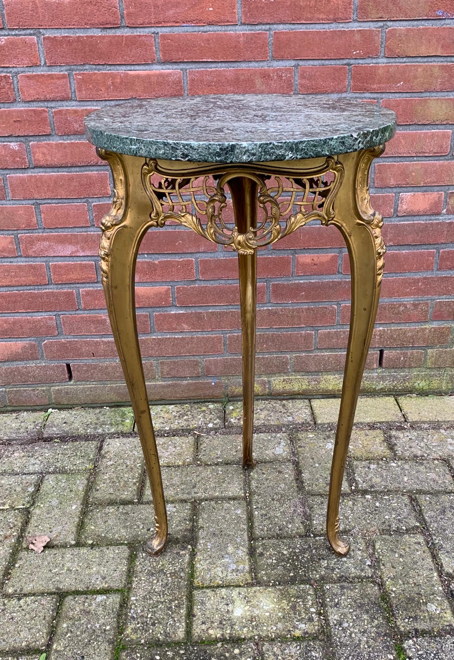 Unique and impressive, finest quality and gilt bronze table.

If you are looking for a remarkable antique table to grace your living space then this highly stylish specimen could be flying your way soon. All handcrafted out of expensive materials
