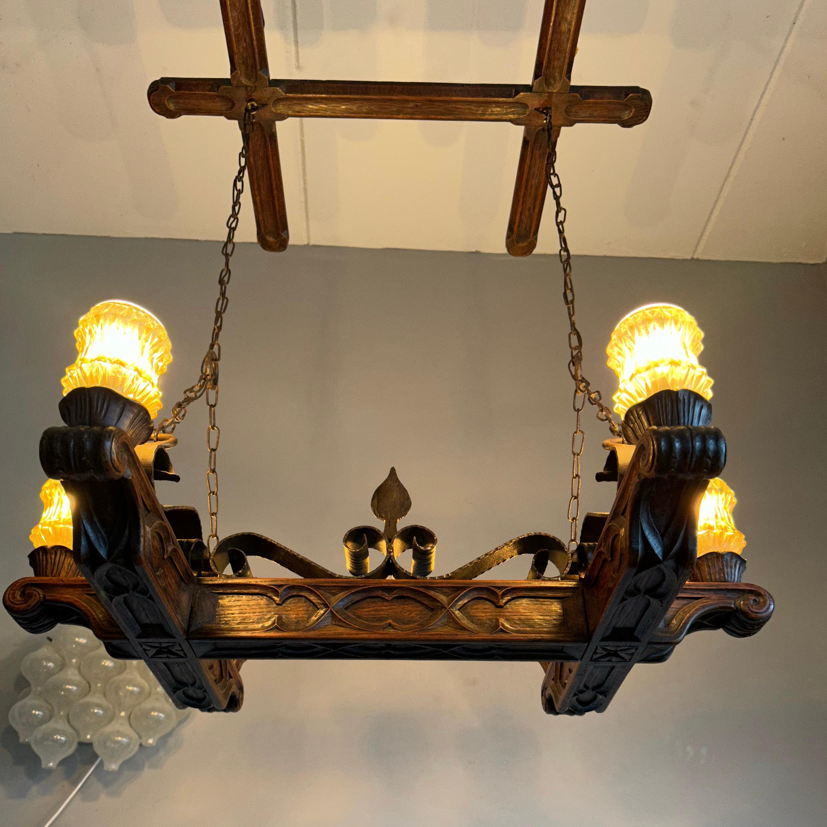 Large size and excellent quality, solid oak Gothic Revival light fixture. 

If you have visited Gothic churches then you may have immediately recognized some of the wonderful design elements of this Gothic chandelier. This all handcrafted and