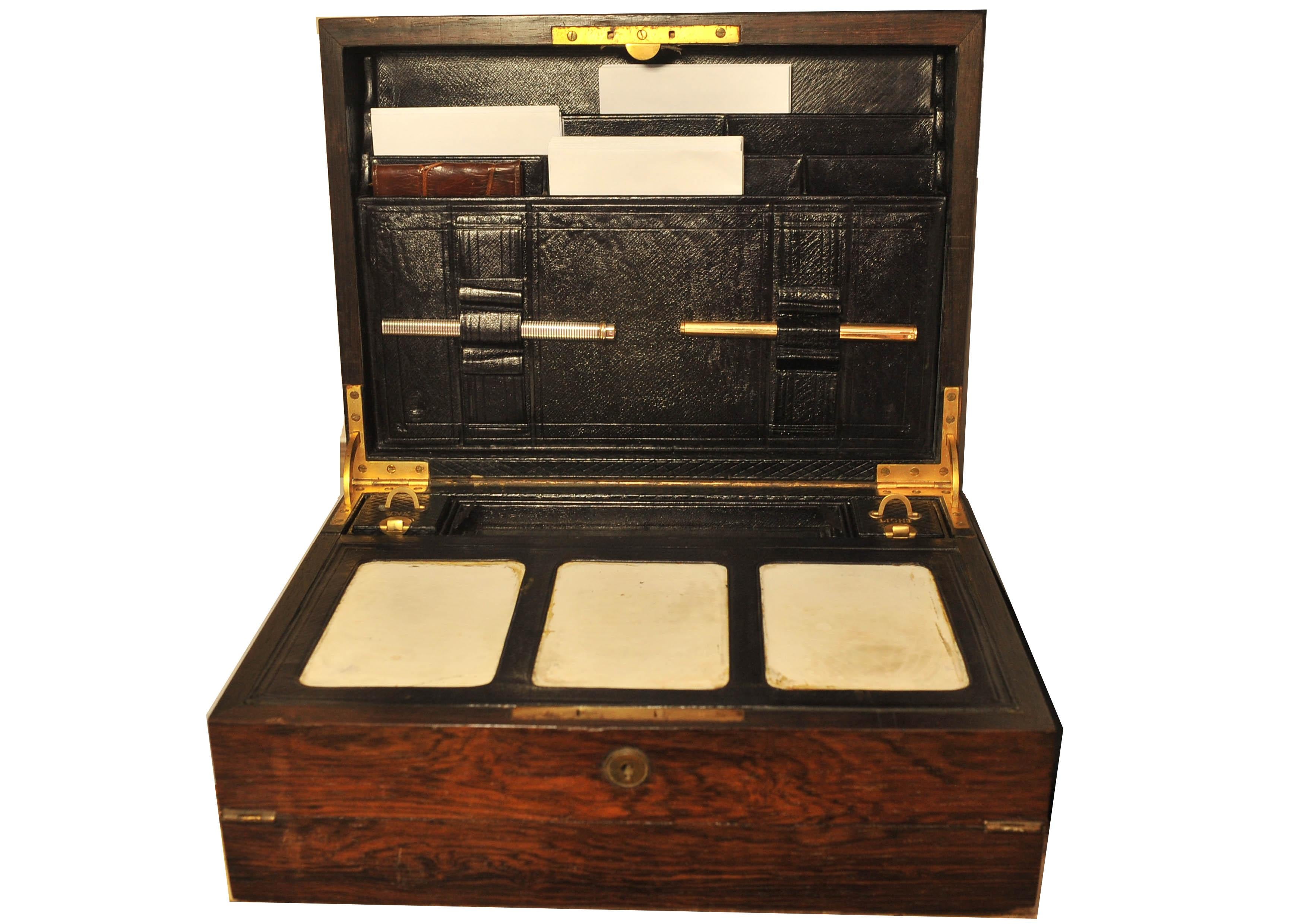 A Beautiful & Luxurious Handcrafted Regency Bramah Rosewood Fold-out Travelling Writing Companion With Fitted Leather Interior, Ceramic Blotting Tablets.
Complete with Beautifully Designed inkwell and match-striker for light. New notepad pad, Quill