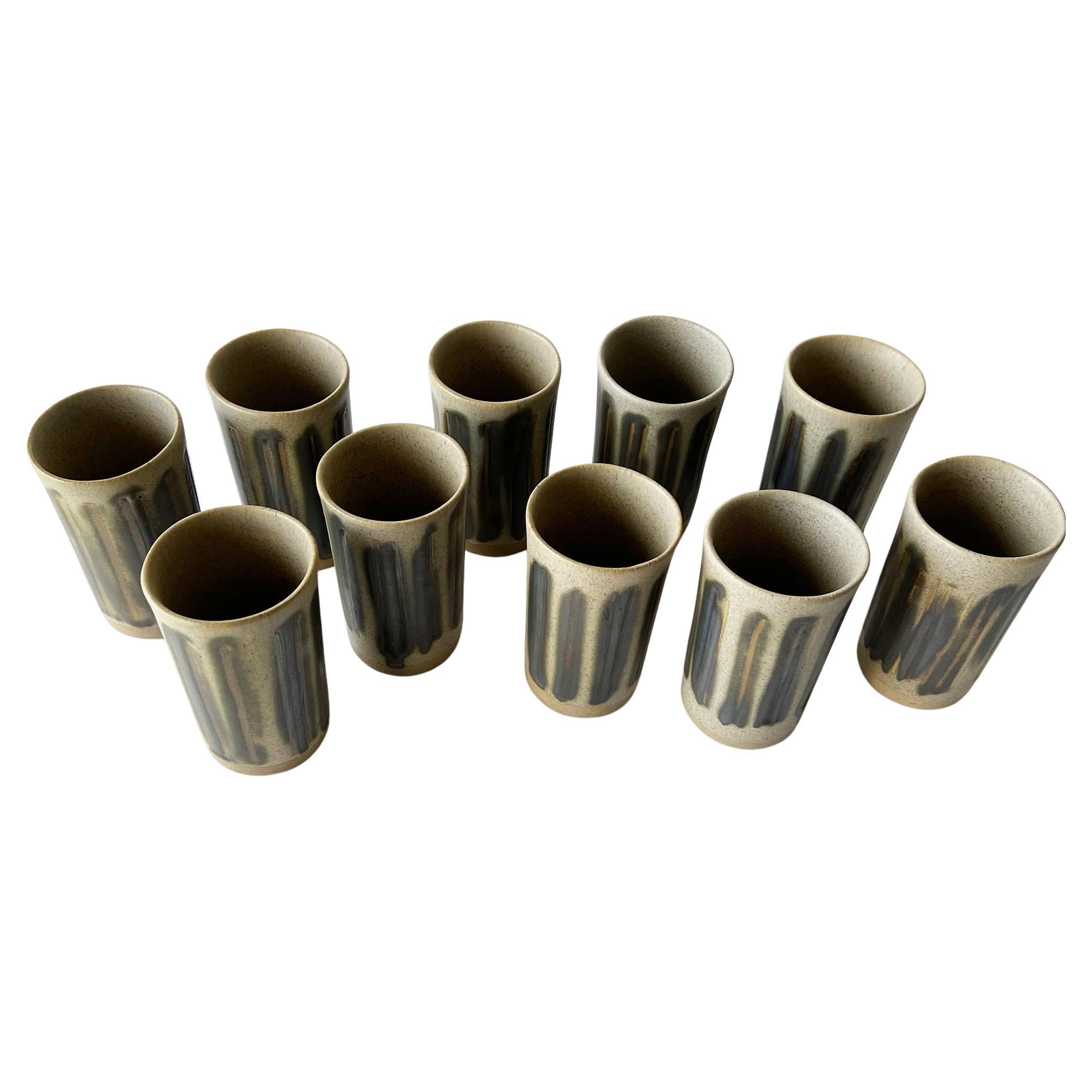 Rare set of 10 stoneware tumblers created by Gordon and Jane Martz. They measure 5 5/8