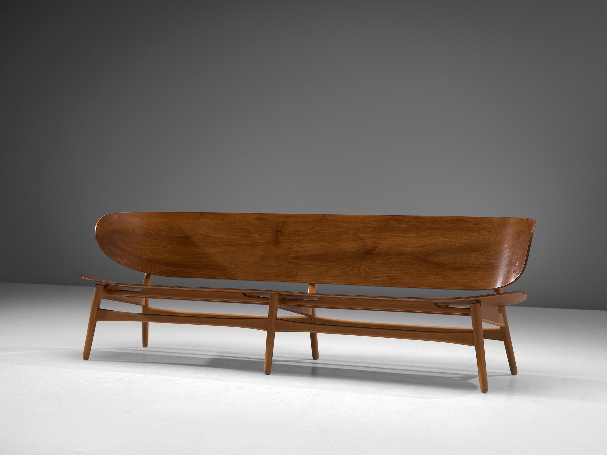 Hans J. Wegner for Fritz Hansen, FH 1935-1934 sofa bench, walnut and beech, Denmark, design 1948, manufactured, circa 1950.

This rare and largest version ever made of the FH 1935 sofa bench by Hans Wegner, this piece is one of the results of