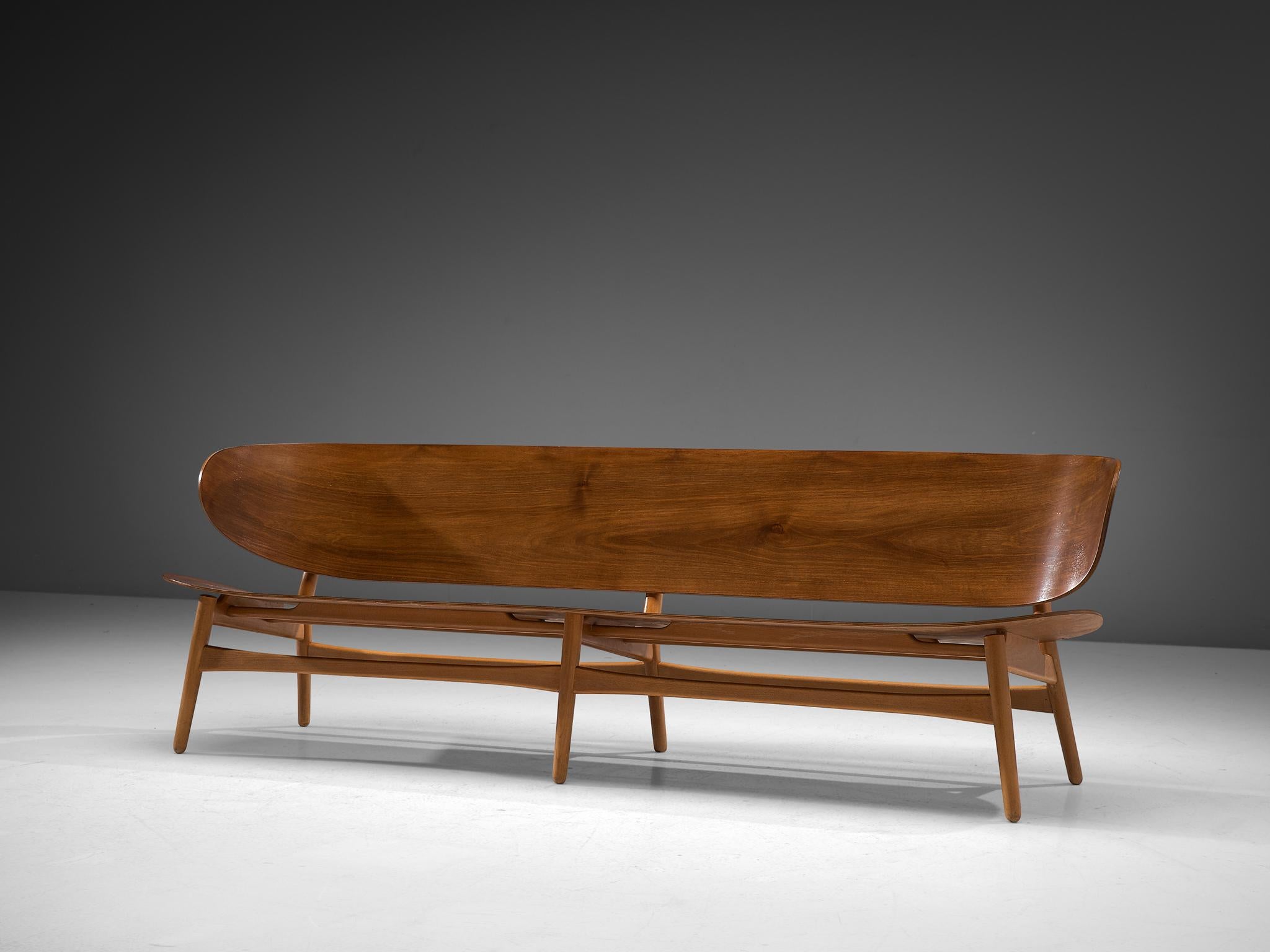 Hans J. Wegner for Fritz Hansen, FH 1935 bench, walnut and beech, Denmark, design 1948, manufactured circa 1950

This rare and largest version ever made of the FH 1935 bench with sofa appeal by Hans J. Wegner. This piece is one of the results of