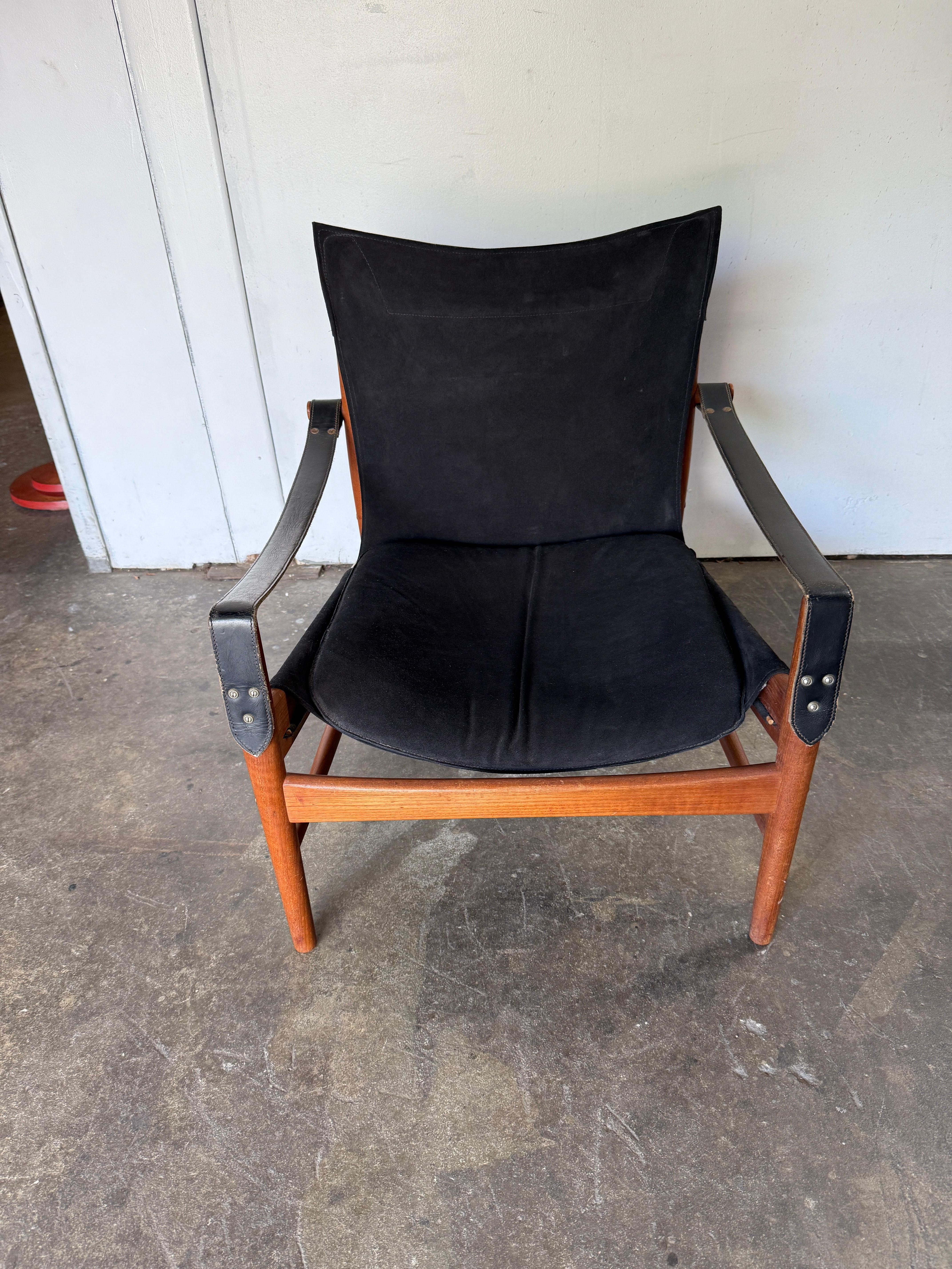 Exceptional Antelope Safari or Hunting lounge chair by Hans Olsen produced by Viskadalens Möbler of Denmark circa 1960. This chair features an elegant and solid Teak frame which holds a beautiful patina Suede leather seat and arm. The chair is in