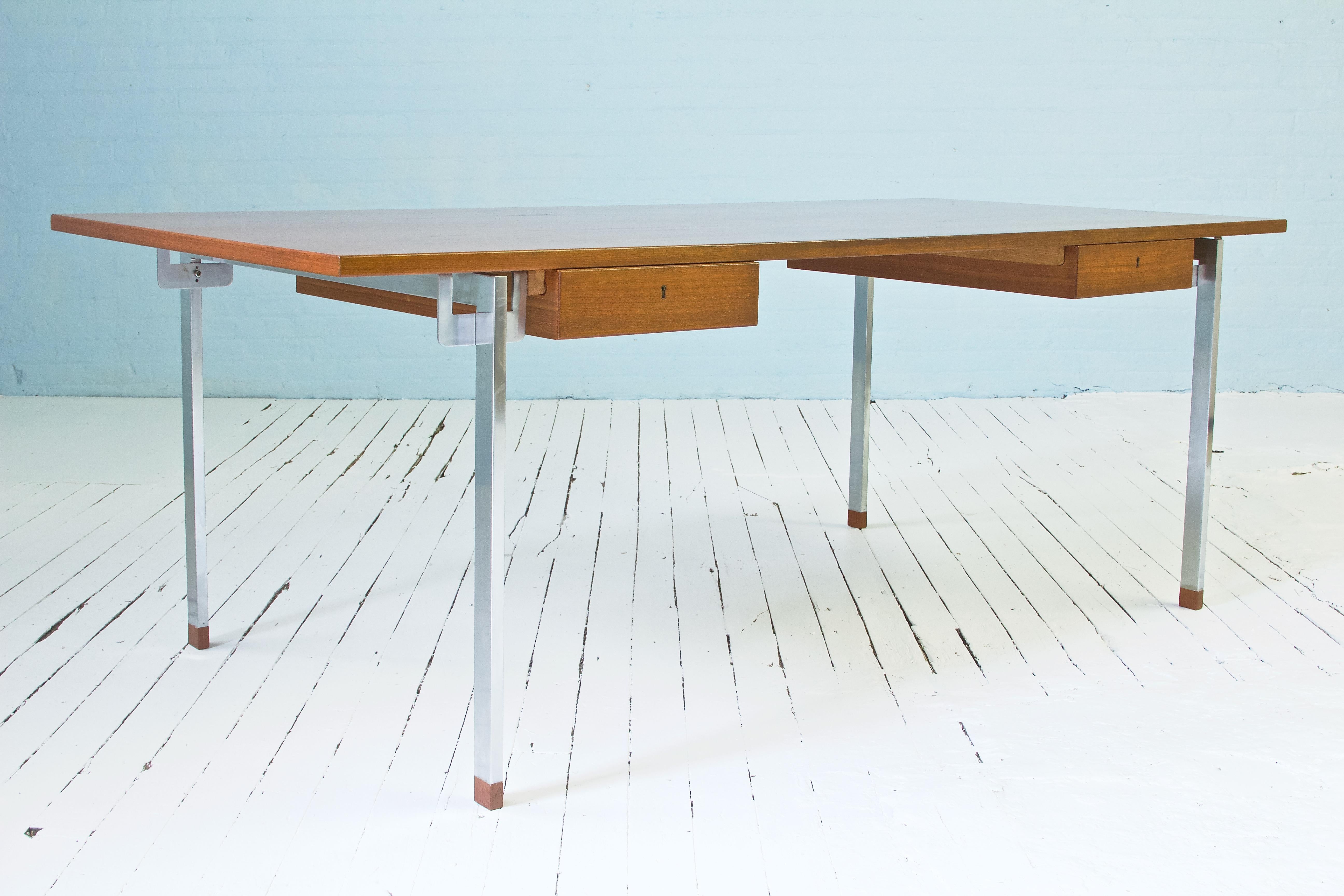 Hans J. Wegner's partnership with Andreas Tuck produced some of his most innovative designs in desks and tables. This rare desk, designed in the 1960s, foreshadows Wegner's departure from strictly wood-based designs; demonstrating his flowering