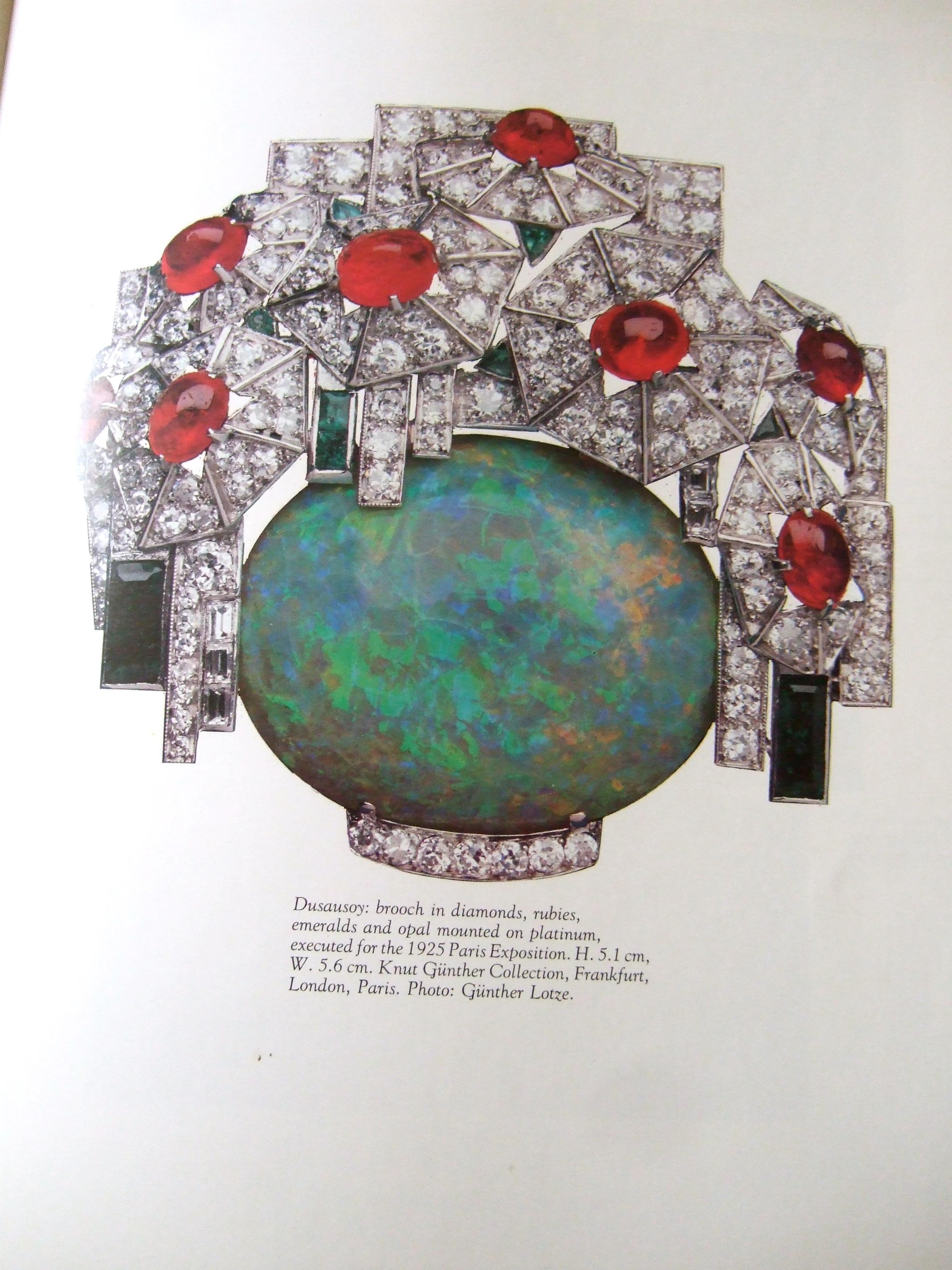 The rare hardcover large scale coffee table Rizzoli book is an extraordinary archive of 20th century art deco jewelry and accessories 
The 329 page book features exquisite art deco designs from preeminent 20th century jewelry companies; Boucheron,