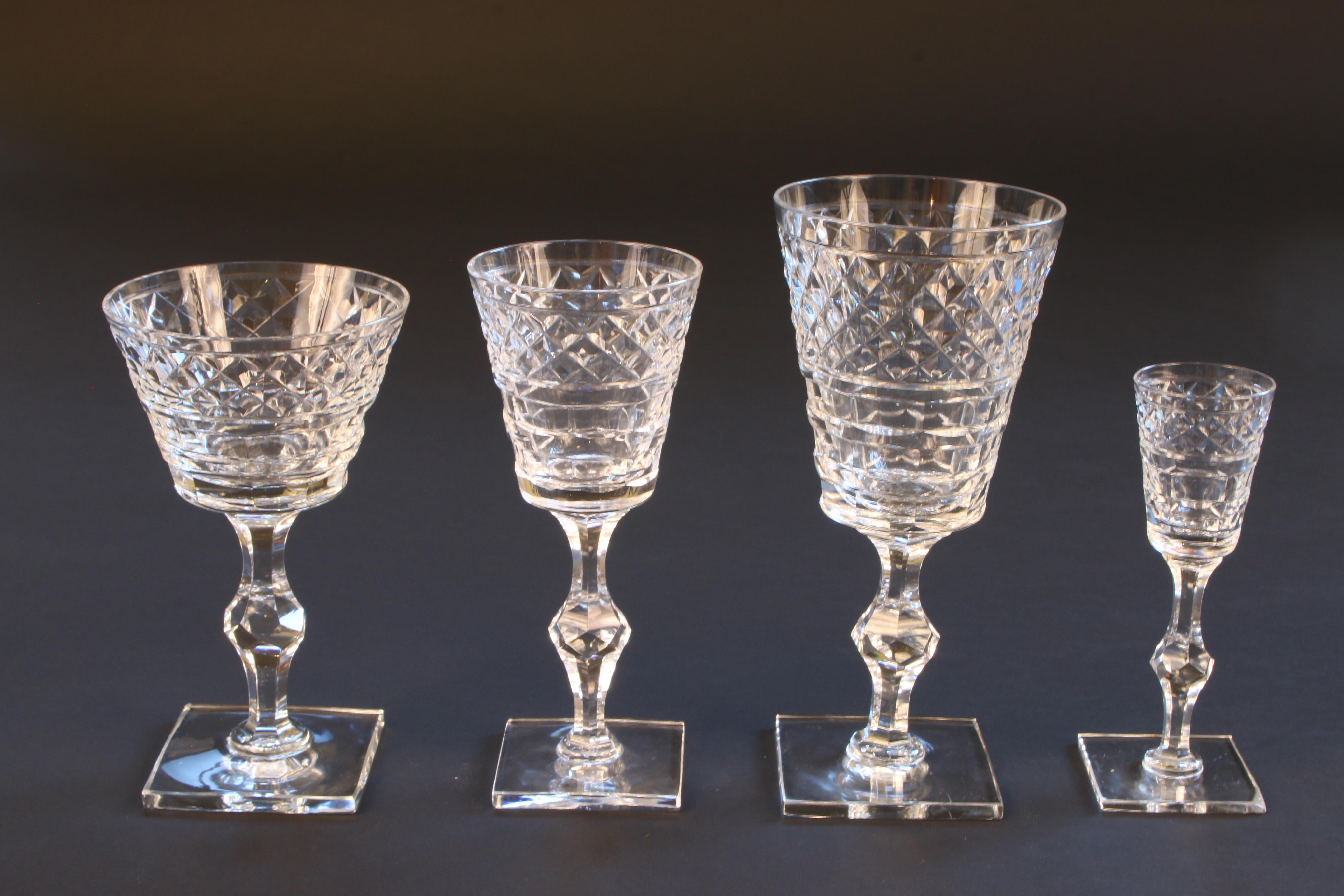 This is a rare vintage Hawkes hand blown, hand-cut service for 12 with extra pieces. The set contains 12 each of water, wine, champagne and cordial. These are big and heavy glasses, the water goblet is 7 3/4 inches high and weighs over a pound thus