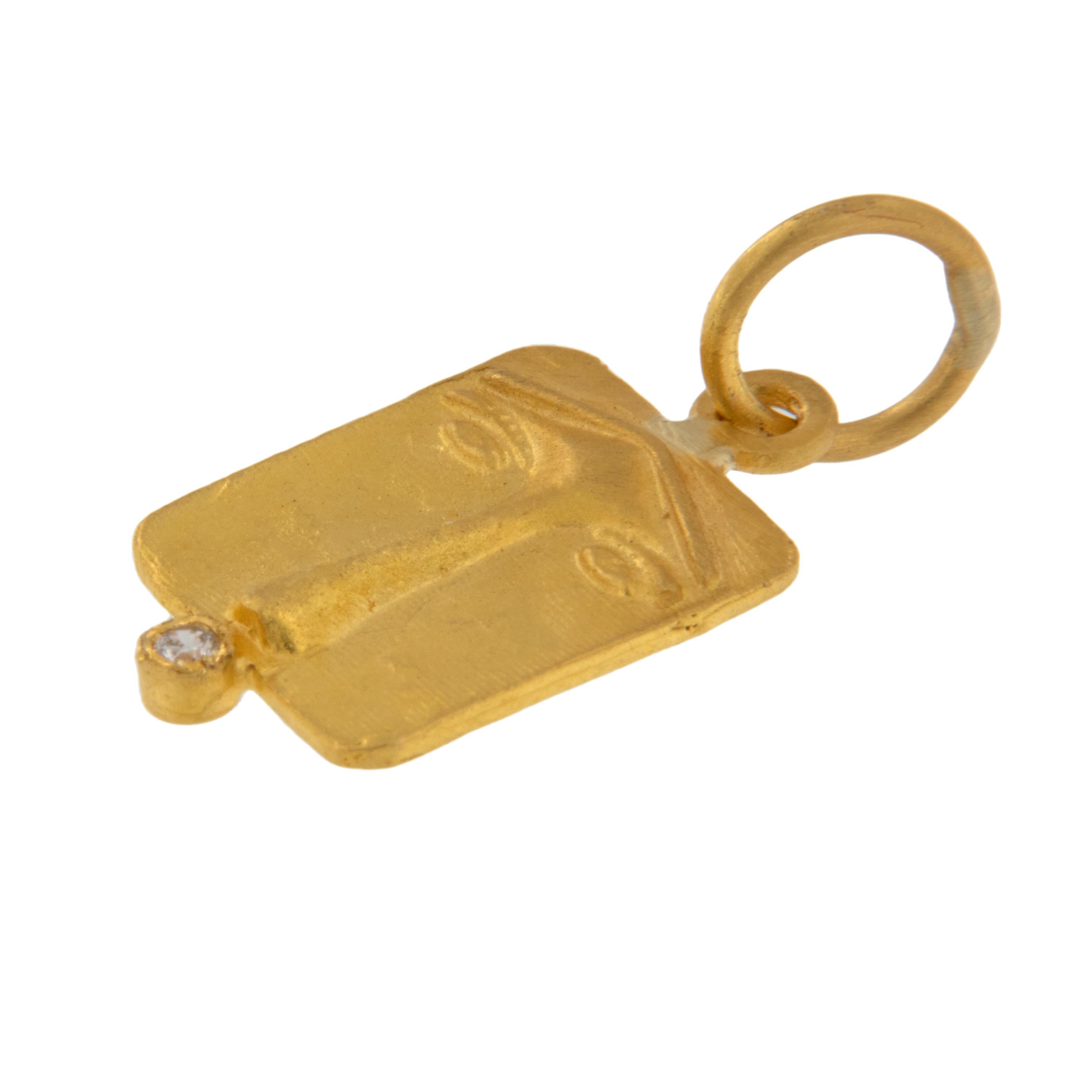 Rarest of all the golds, 24 karat gold is valued by all discerning investors. With it's unmistakable warm yellow color & hammered finish this noble pendant / charm features the Protector of Dwellings / Ancient Lion's Face anchored at the bottom with